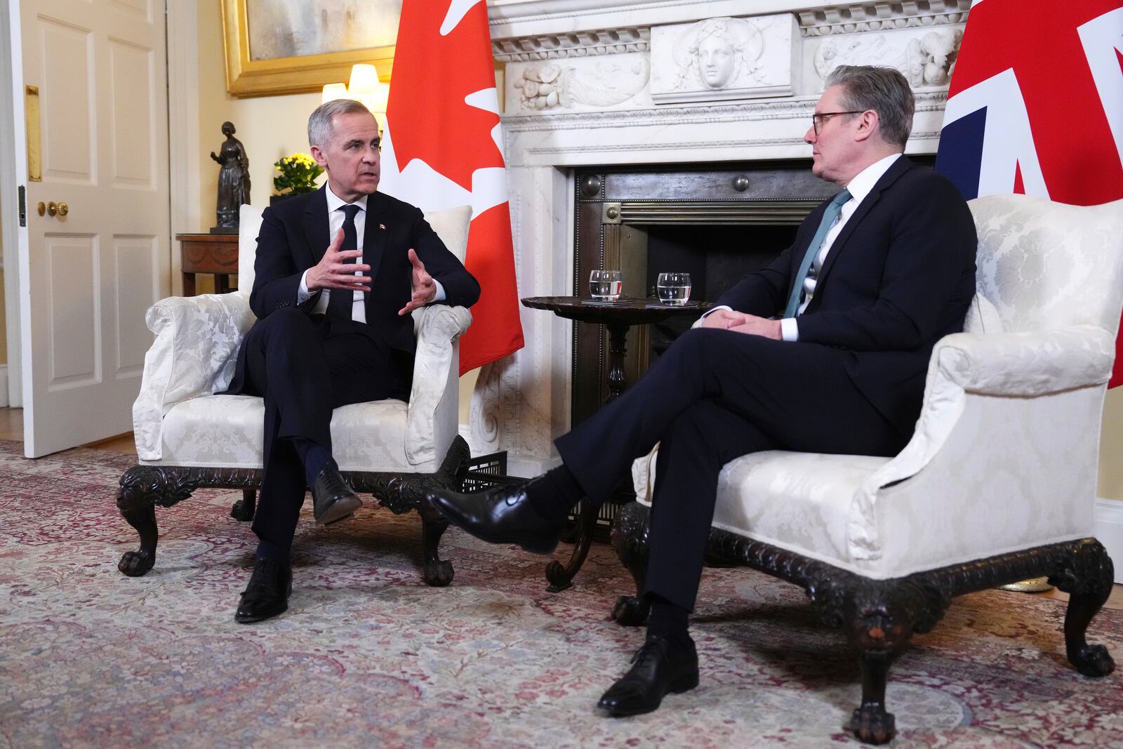 Canada Prime Minister Mark Carney meets with British Prime Minister Keir Starmer as he arrives in London on Monday, March 17, 2025. (Sean Kilpatrick/The Canadian Press via AP)