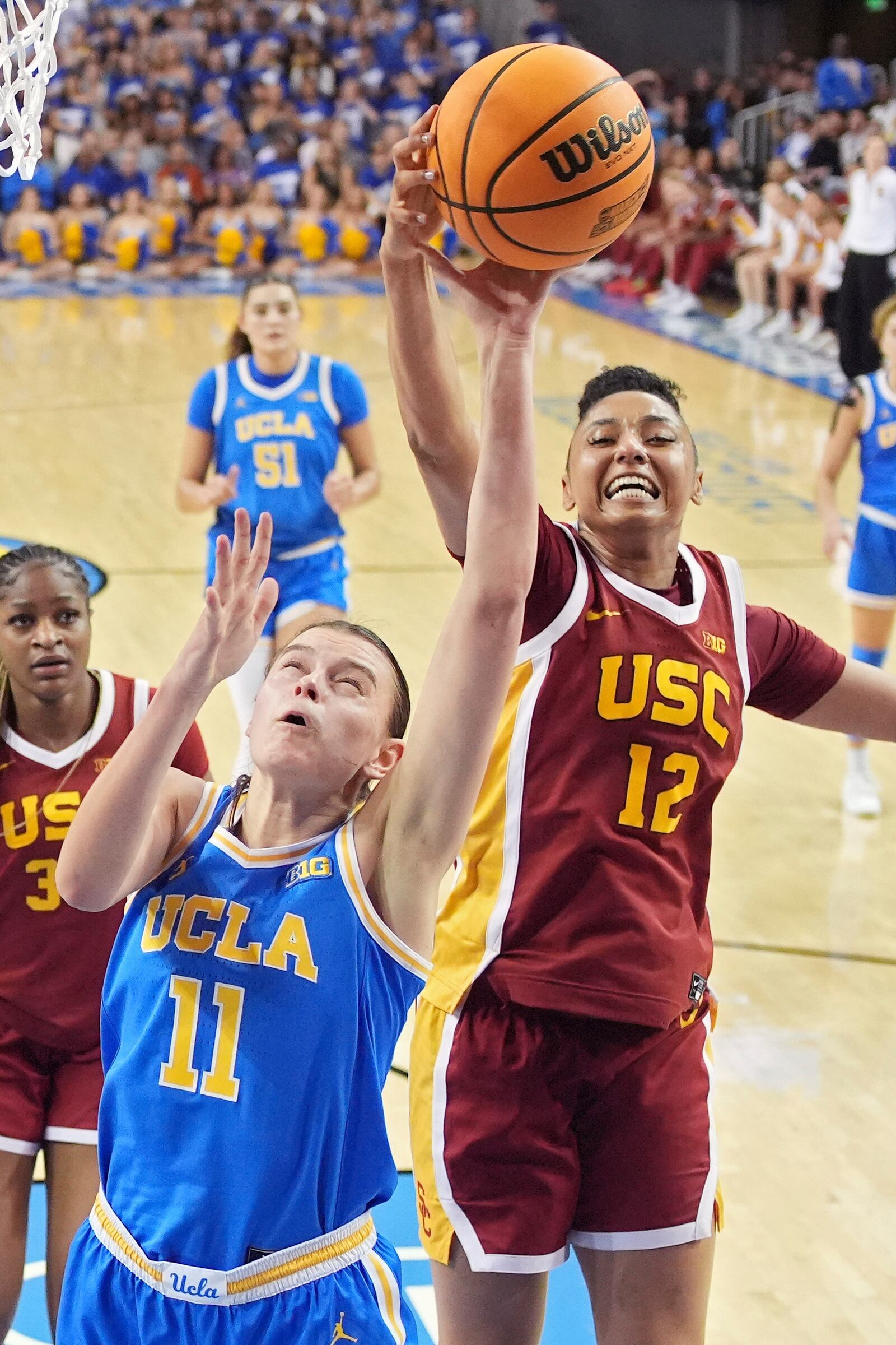 UCLA guard Gabriela Jaquez (11) shoots as Southern California guard JuJu Watkins (12) blocks it during the second half of an NCAA college basketball game Saturday, March 1, 2025, in Los Angeles. (AP Photo/Mark J. Terrill)