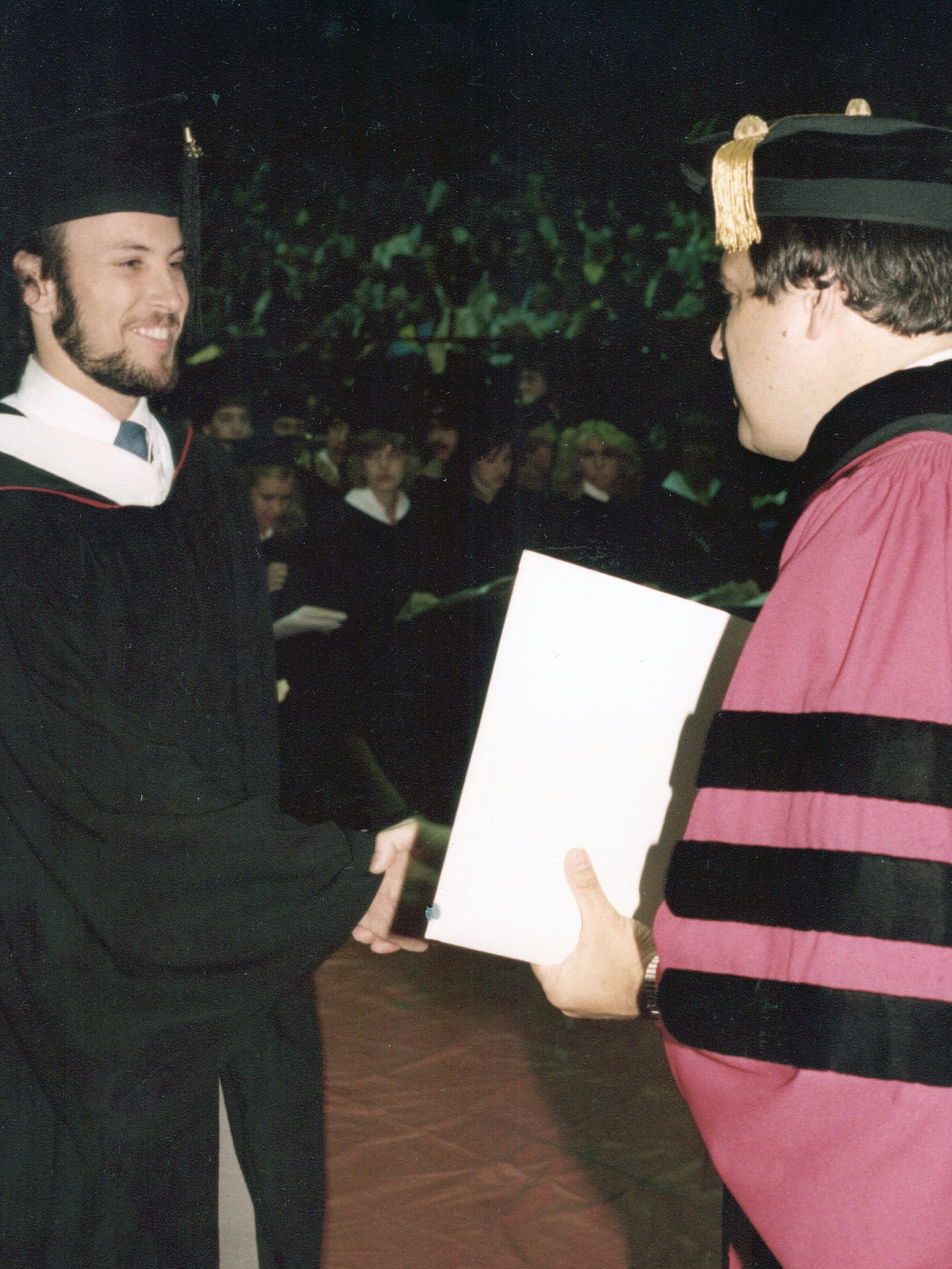 Doran (L) graduating from the University of Dayton in 1982. His youngest son, Eric, is also a UD graduate.