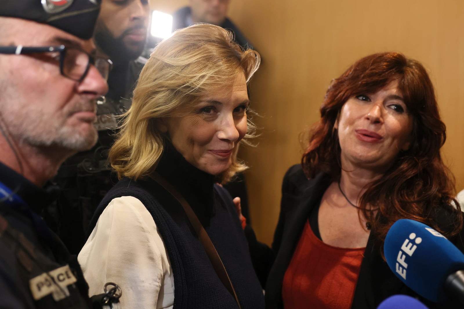 Plaintiff Amélie Kyndt leaves the courtroom with plaintiffs' lawyer Carine Durrieu Diebolt, right, while actor Gerard Depardieu, who is facing trial for the alleged sexual assaults of two women on a film set in 2021, did not appear before a criminal court, Monday, Oct. 28, 2024 in Paris. (AP Photo/Thomas Padilla)