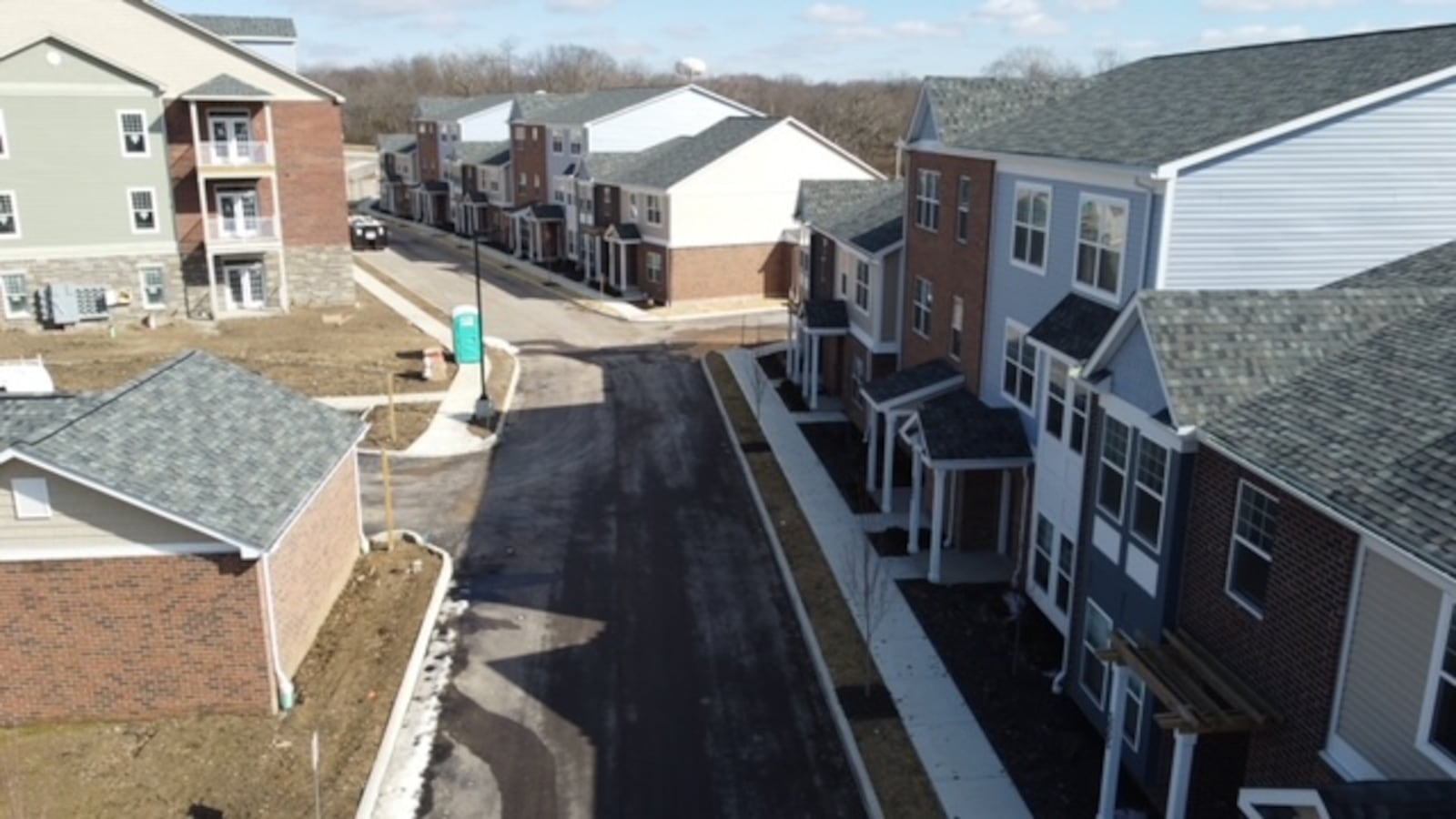 This is a drone view of some of the apartments and townhomes that are part of the 511 N. Broadway mixed-use project. Only two residential units of more than 100 remain unleased as of Thursday. The new restaurants are expected to open later this fall. CONTRIBUTED/CMC PROPERTIES