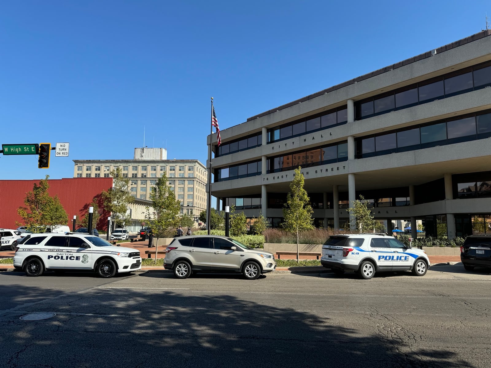 Springfield, Dayton police, along with the State Highway Patrol search the Springfield City Hall after it was evacuated due to a threat Thursday. BILL LACKEY/STAFF