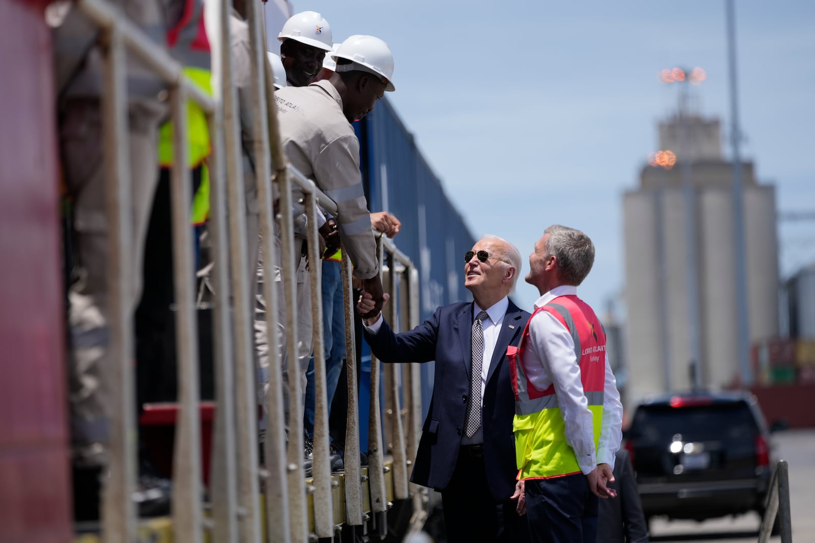 President Joe Biden and Chief Operating Officer of Lobito Atlantic Railway Nicolas Gregoire meet rail workers during the tour of the Lobito Port Terminal in Lobito, Angola, on Wednesday, Dec. 4, 2024. (AP Photo/Ben Curtis)