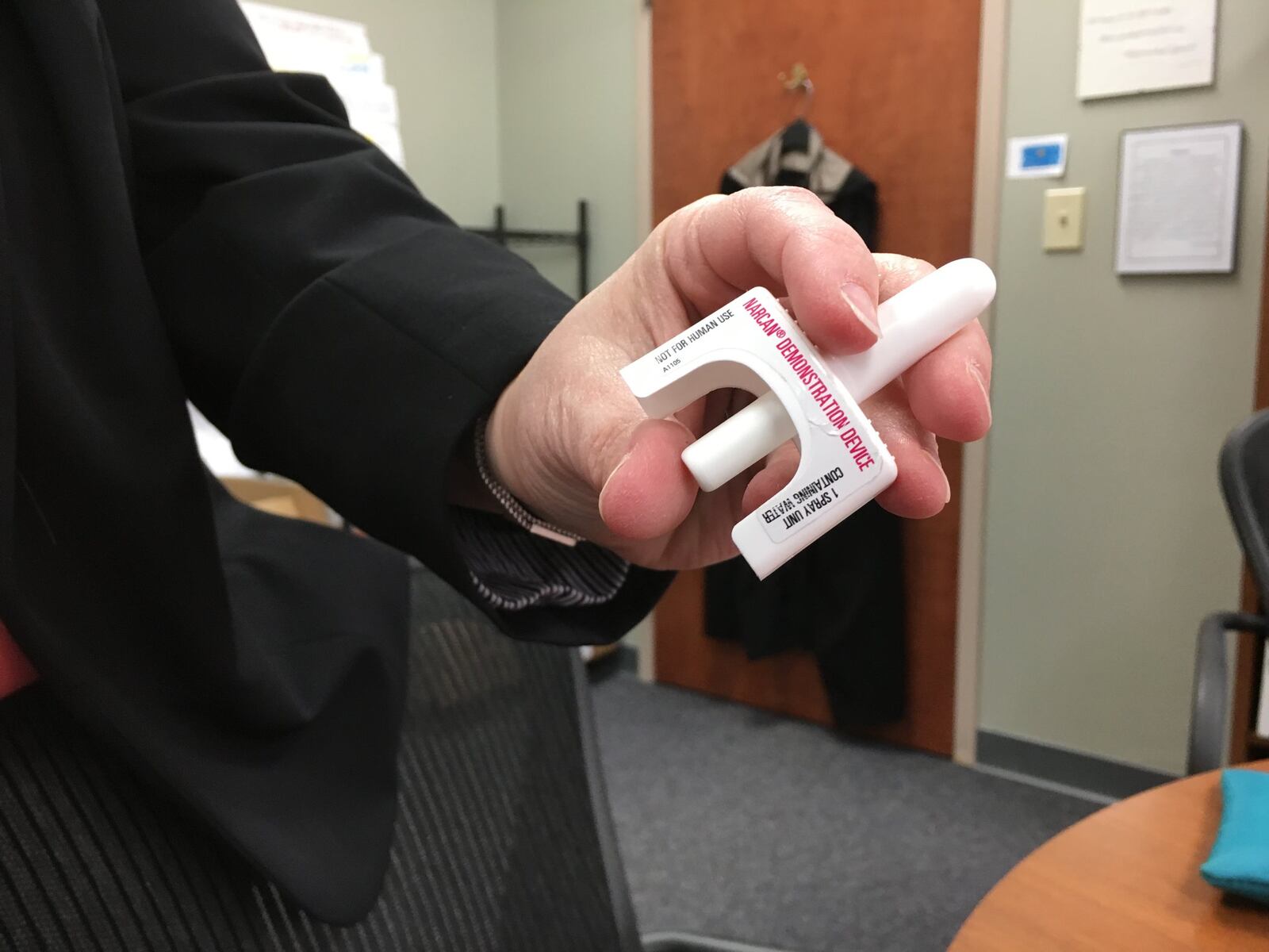 Jodi Long, director of treatment and supportive services, Montgomery County Alcohol, Drug Addiction & Mental Health Services, holds up a naloxone nasal spray. The U.S. Surgeon General has recommended that more people carry the overdose-reversing drug. KATIE WEDELL/STAFF