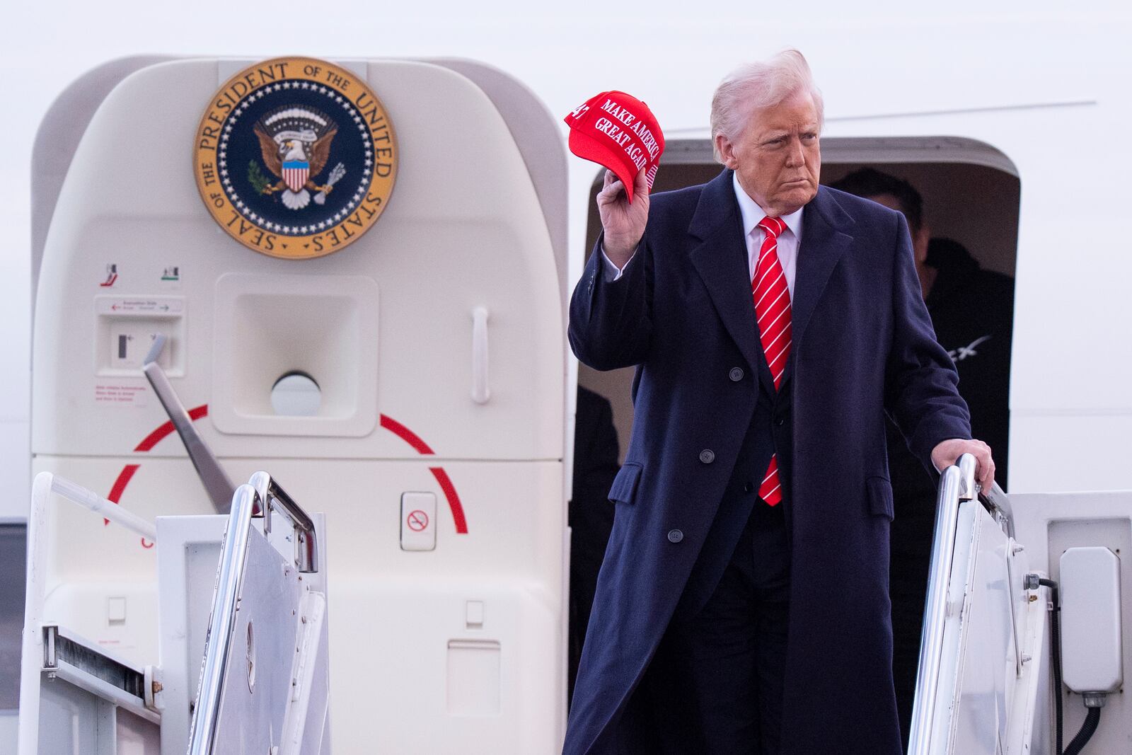 President Donald Trump arrives on Air Force One at Philadelphia International Airport, Saturday, March 22, 2025, in Philadelphia. (AP Photo/Chris Szagola)