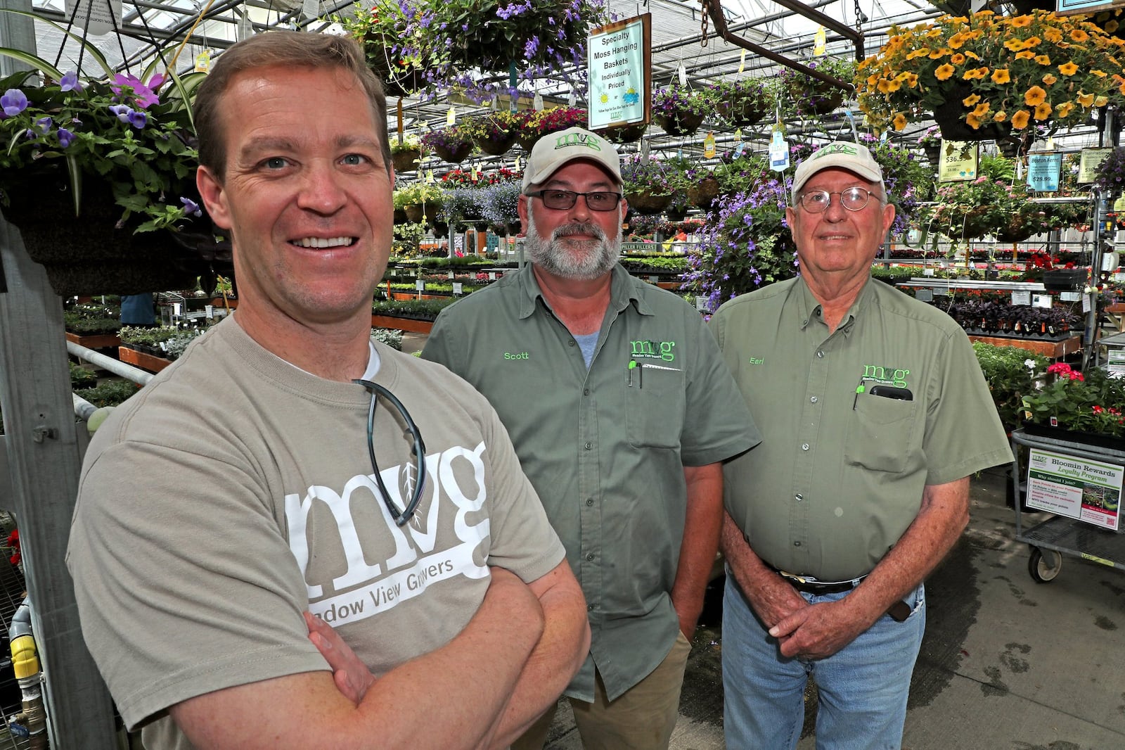 Jeff Pack (left) bought Meadow View Growers in 2018 and said then he wanted people to know that Scott (center), and Earl would still be working at the garden center. Bill Lackey/Staff