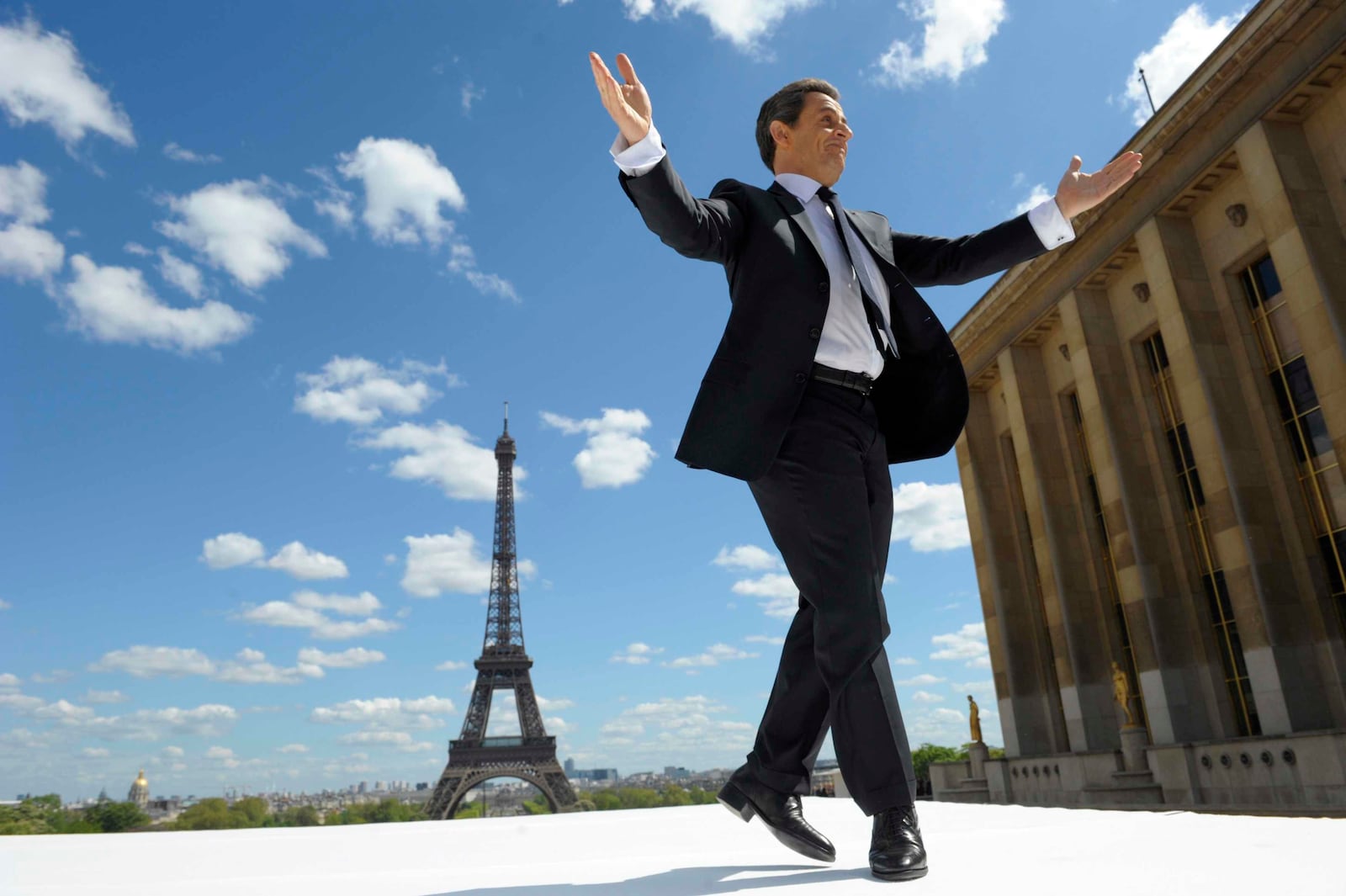 FILE - In this Tuesday May 1, 2012 file picture, French President and conservative candidate for his re-election in the 2012 French presidential elections, Nicolas Sarkozy reacts to supporters as he arrives on stage at Trocadero square. (AP Photo/Philippe Wojazer, Pool, File)