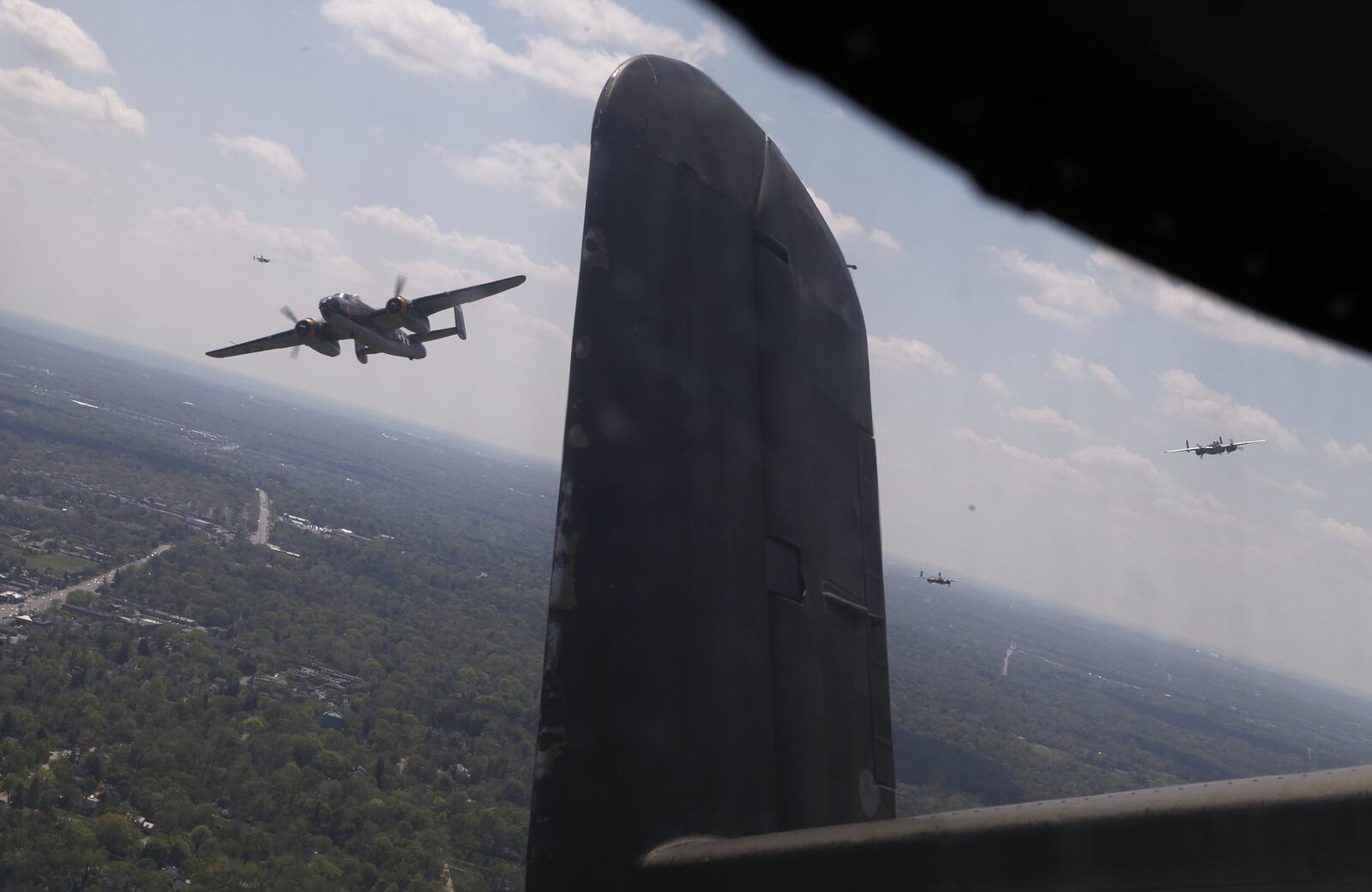 B-25s fly in formation over a National Museum of the U.S. Air Force memorial service Wednesday, April 18, 2012 on the 70th anniversary of the Doolittle Raid on Tokyo.