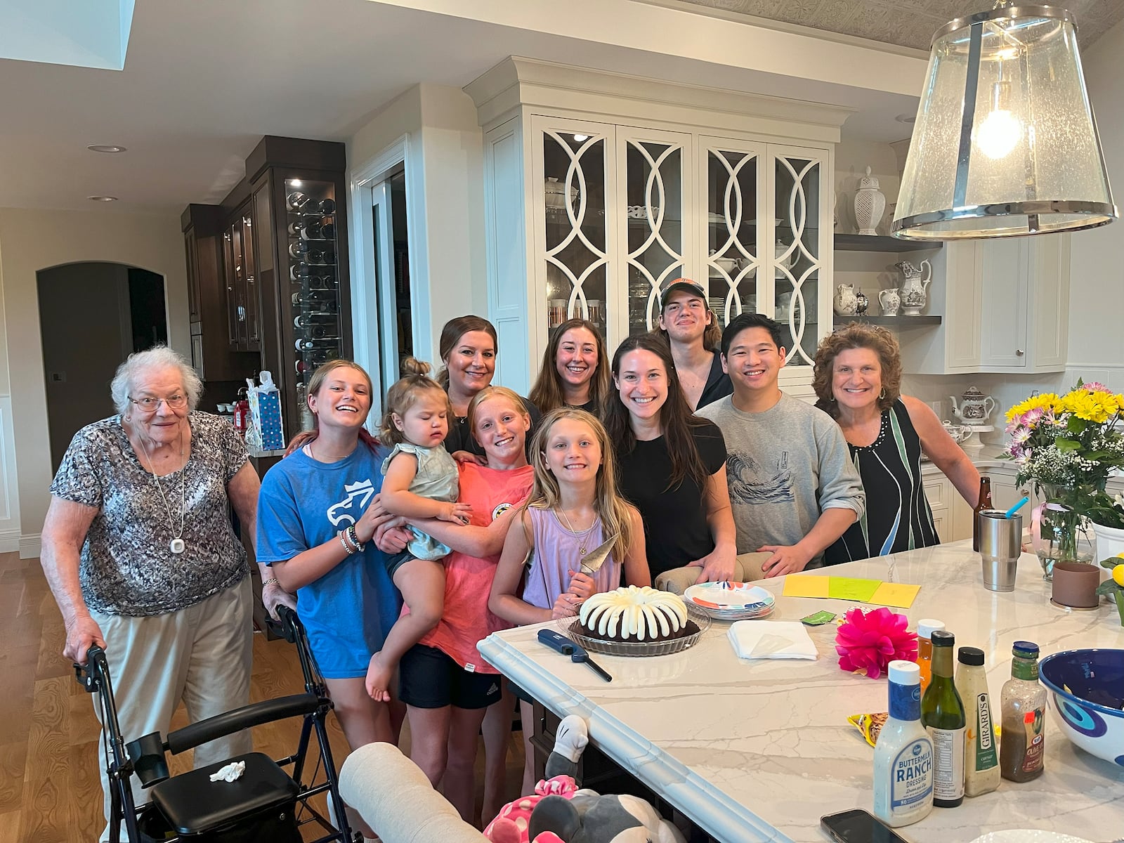 A family gathering on Hickory Knoll Court in Woodbridge include Vicki's mother Phyllis (from left), granddaughters Izzi and Eleanor, daughter Nicole, granddaughters Stella and Madeline, daughter Allison, grandsons Ben and Austin, Vicki and granddaughter Charlie (in front).