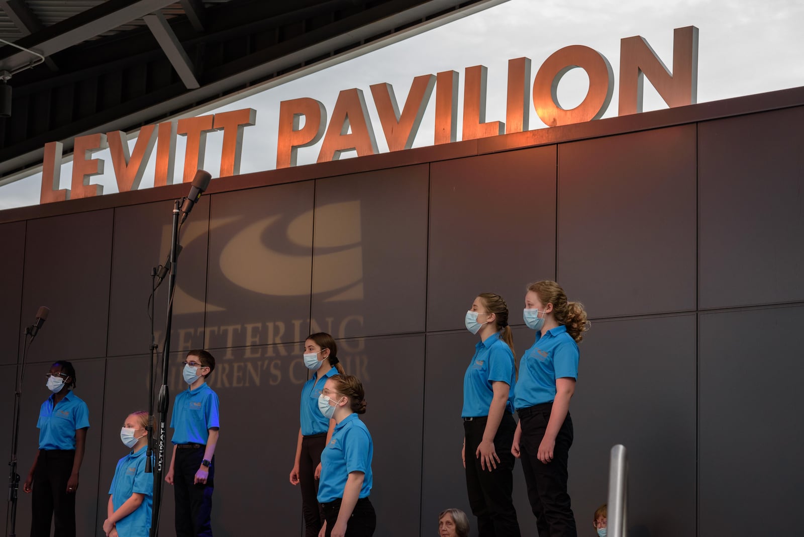 The Kettering Children’s Choir Spring Concert signaled the return of in-person concerts at Levitt Pavilion in downtown Dayton on Saturday, May 15, 2021. Levitt’s entire 2020 season of free concerts were cancelled due to the coronavirus pandemic. Circles have been spray painted on the lawn to designate socially distanced seating areas for guests who bring lawn chairs and/or blankets. TOM GILLIAM / CONTRIBUTING PHOTOGRAPHER