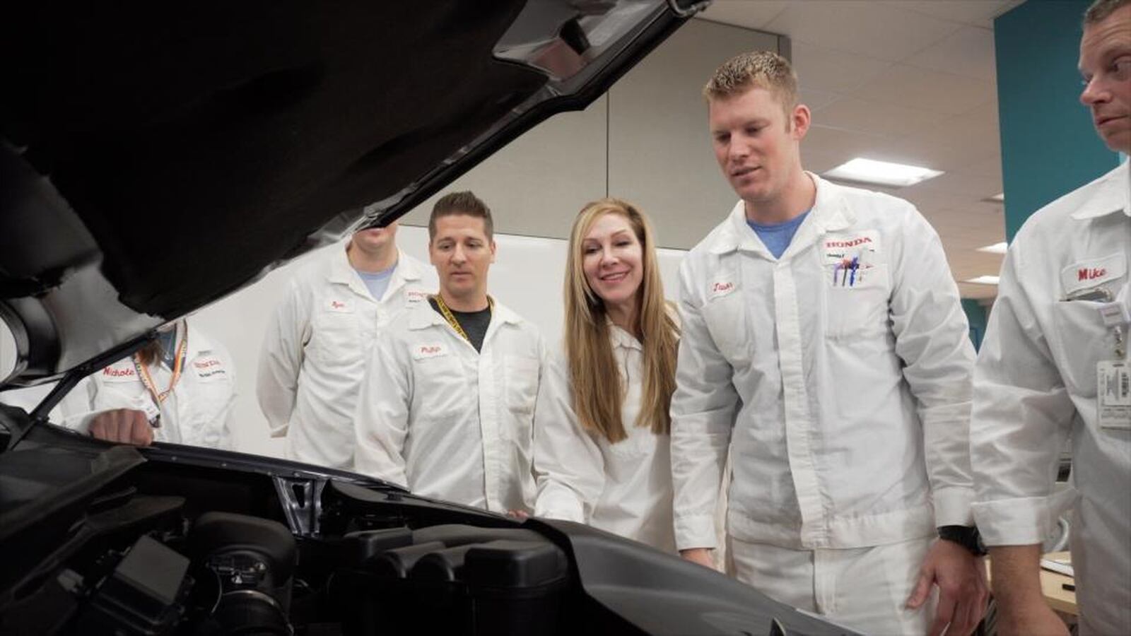 Lara Harrington, a Huber Heights native and a chief engineer at Honda R&D Americas, photographed by Honda at work with colleagues. CONTRIBUTED.