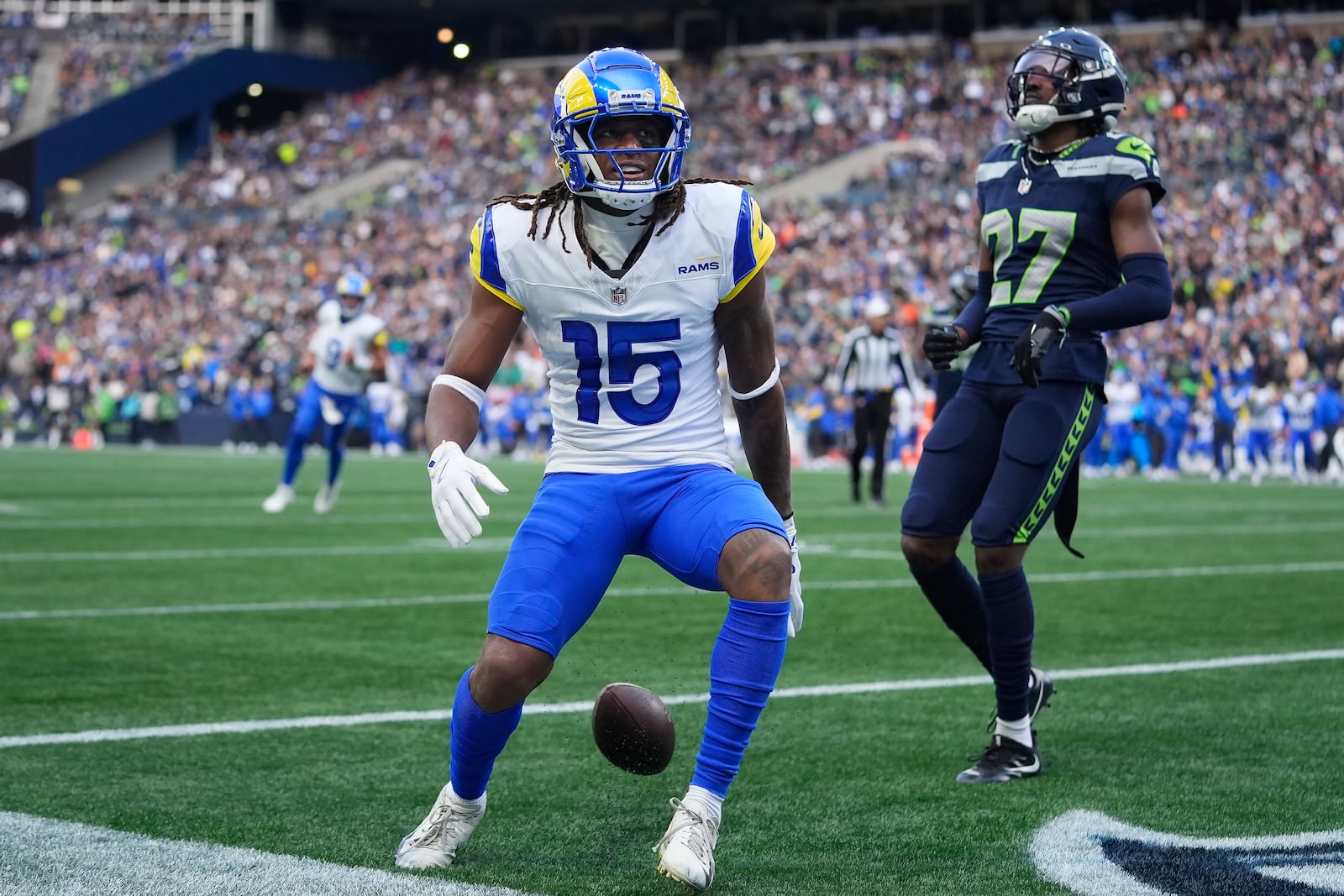 Los Angeles Rams wide receiver Demarcus Robinson (15) reacts after scoring a touchdown past Seattle Seahawks cornerback Riq Woolen (27) during the second half of an NFL football game in Seattle, Sunday, Nov. 3, 2024. (AP Photo/Lindsey Wasson)