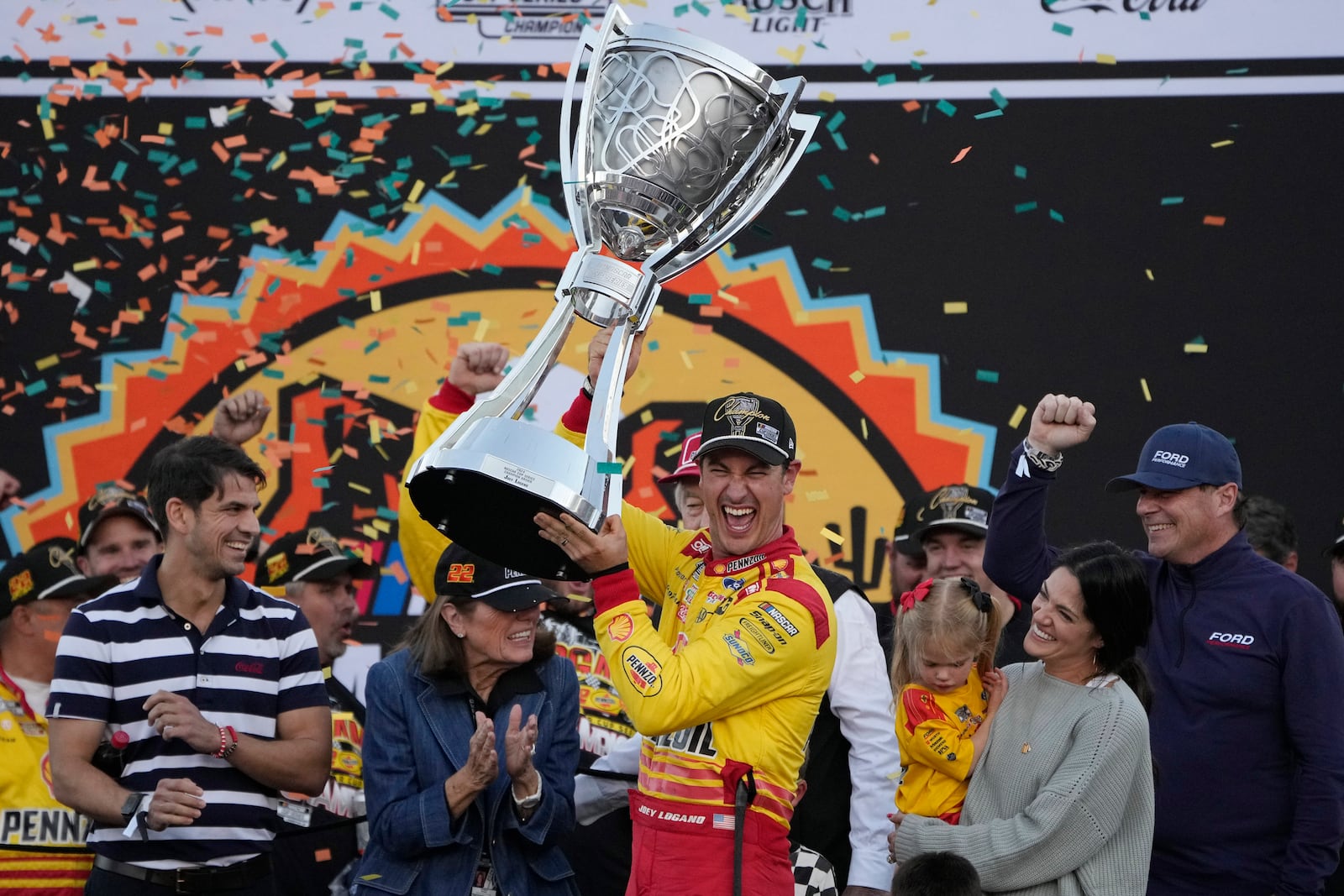 FILE - Joey Logano celebrates after winning a NASCAR Cup Series Championship auto race for the championship at Phoenix Raceway, Nov. 10, 2024, in Avondale, Ariz. (AP Photo/John Locher, File)