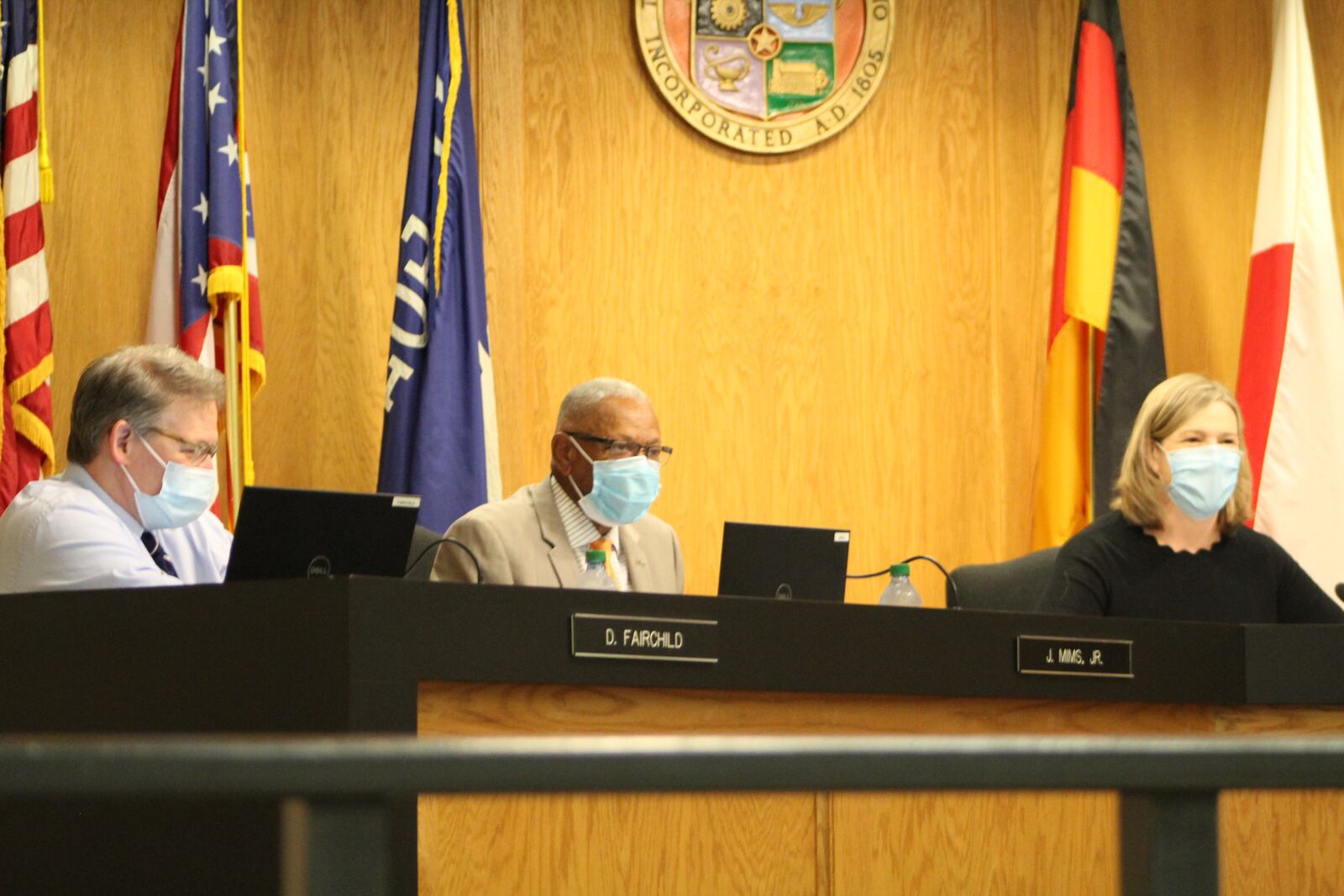 Dayton City Commissioners Darryl Fairchild and Jeff Mims and Mayor Nan Whaley at Wednesday's city commission meeting. CORNELIUS FROLIK / STAFF