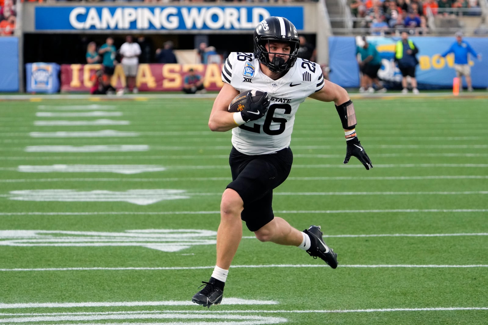 Iowa State running back Carson Hansen runs for a touchdown against Miami on a 13-yard pass play during the first half of the Pop Tarts Bowl NCAA college football game, Saturday, Dec. 28, 2024, in Orlando, Fla. (AP Photo/John Raoux)