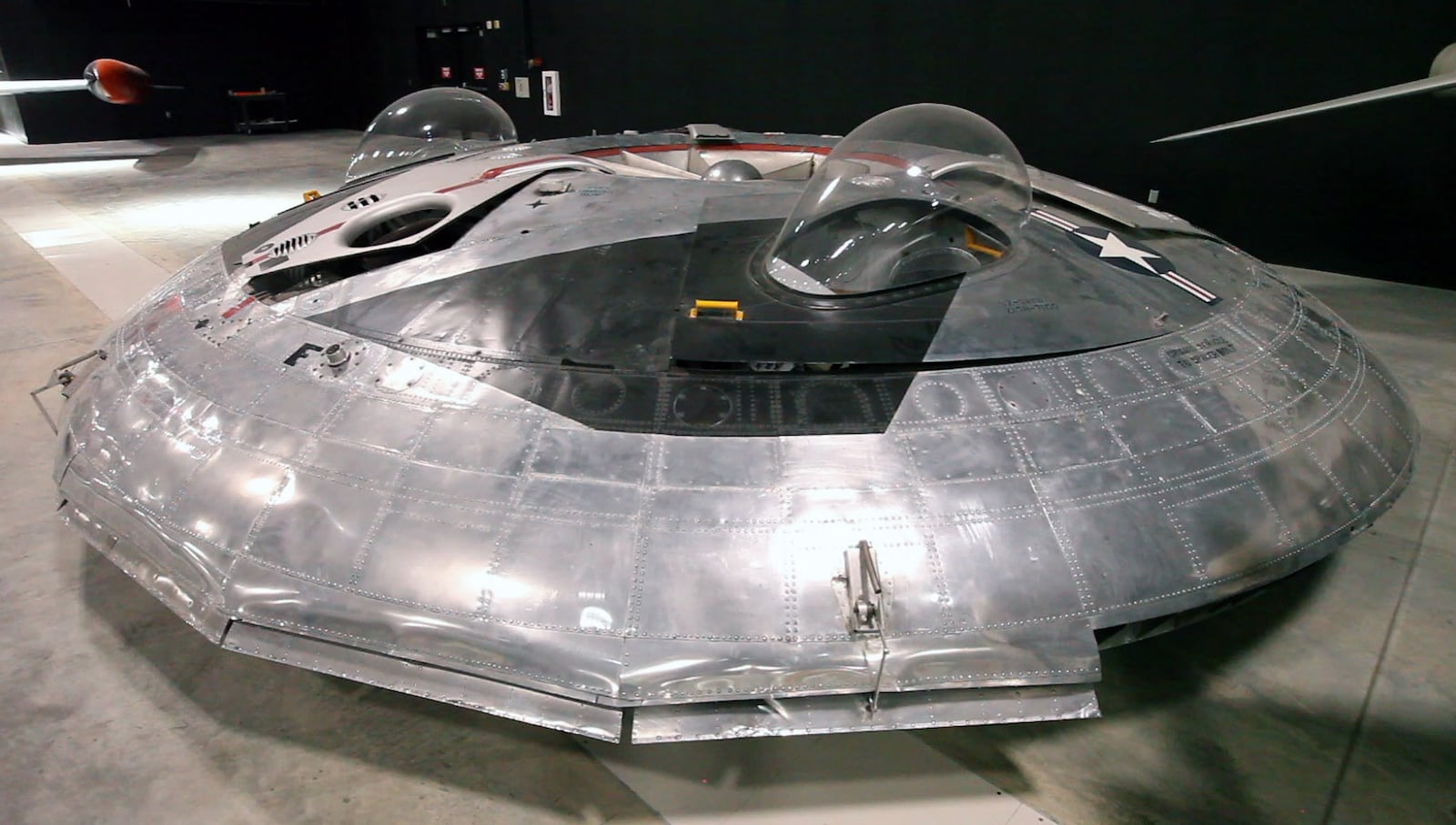 The Avro Canada VZ-9AV Avrocar is as close to a flying saucer that any aircraft gets in the National Museum of the U.S. Air Force fourth building.  The circular flying wing was built with three turbine engines exhaust driving a central circular turborotor.  The Avrocar did fly, but became almost uncontrollable when it left the cushioning ground effect air just a few feet high.