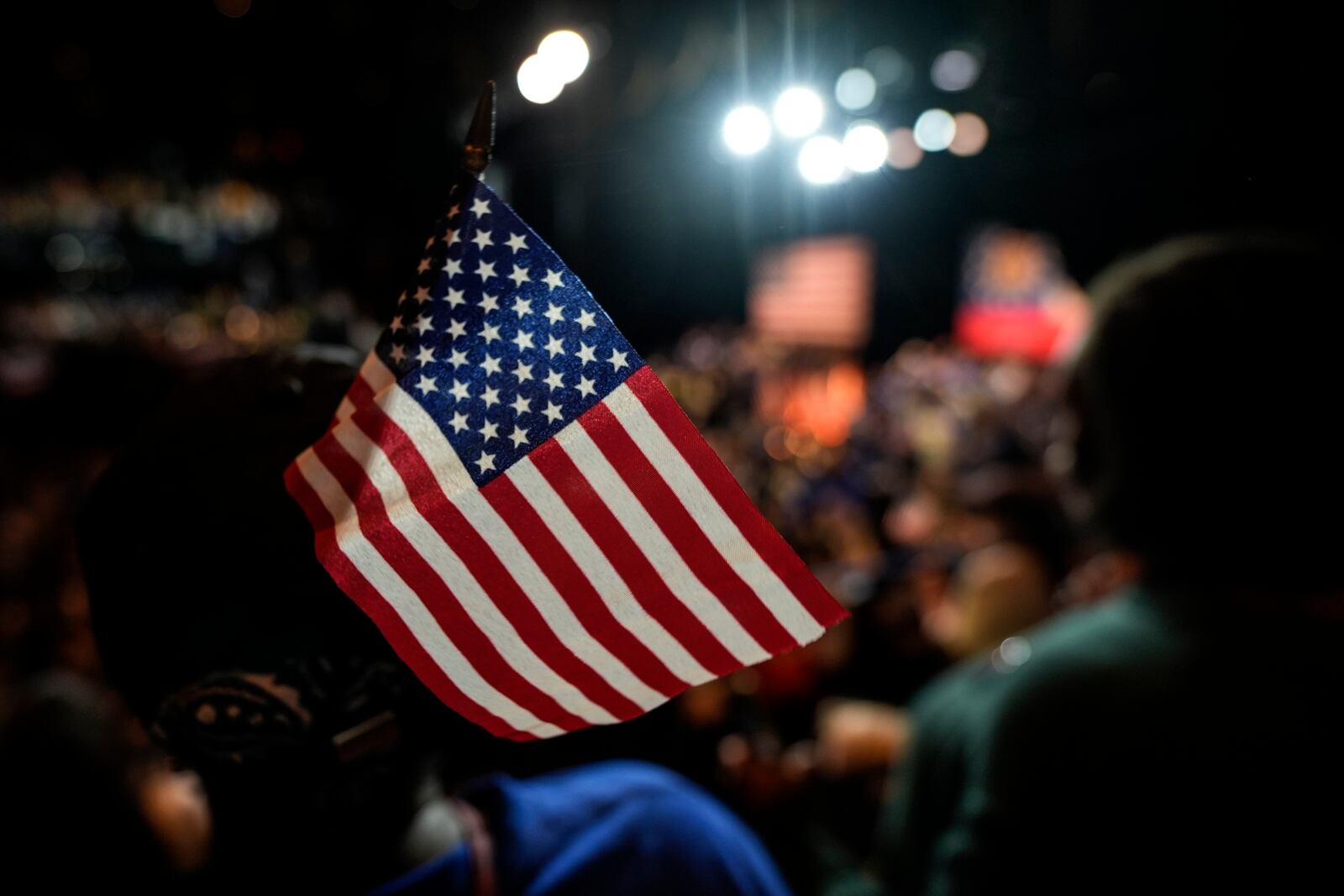 A supporter holds a U.S. flag during a Rally for our Republic gathering, Saturday, March 22, 2025, in Atlanta. (AP Photo/Mike Stewart)