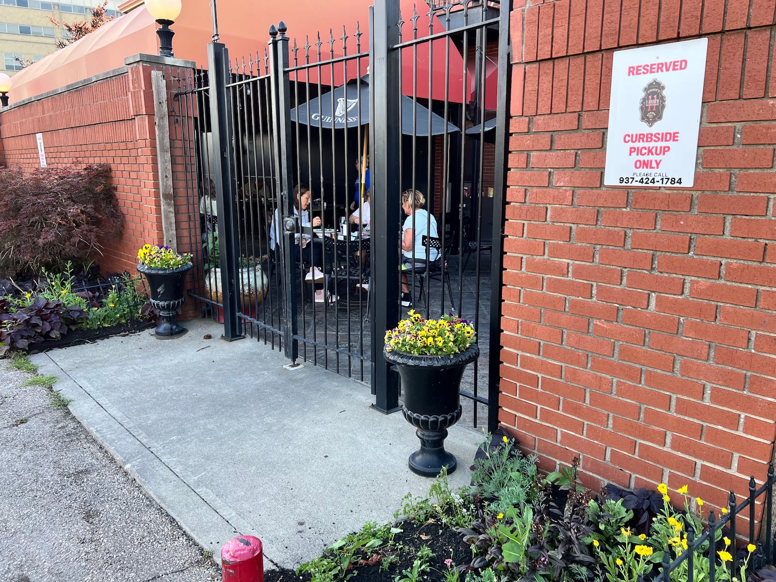 A look at Jimmie's Ladder 11 patio from outside in with a view of some of the planters