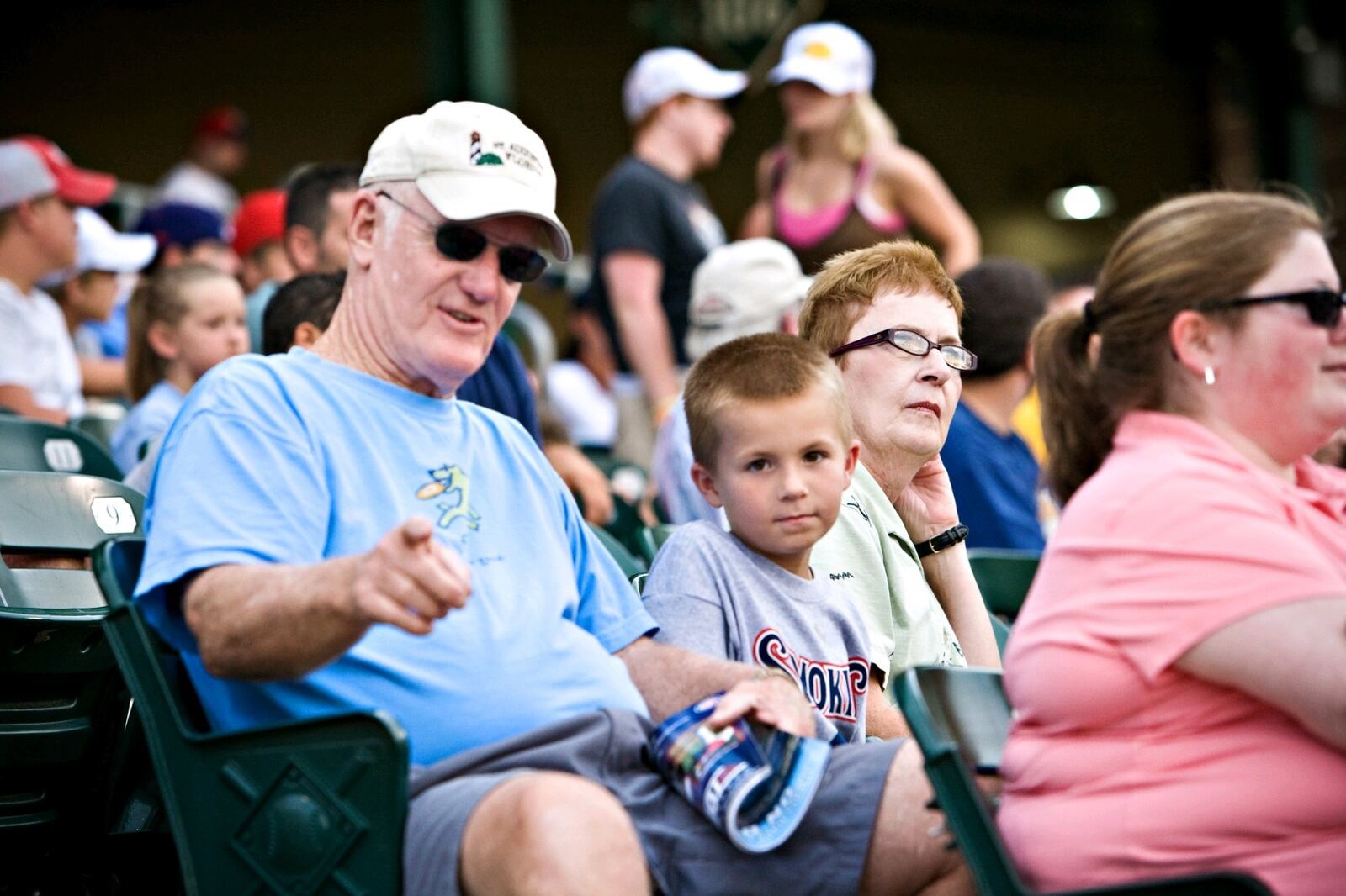 A photo from about a dozen years ago at a minor league baseball game: Kevin O’Neill (in blue shirt), grandson Ryan  O’Neill and Kevin’s wife Connie (in green with glasses). Ryan is now a sophomore at the University of Kentucky. CONTRIBUTED