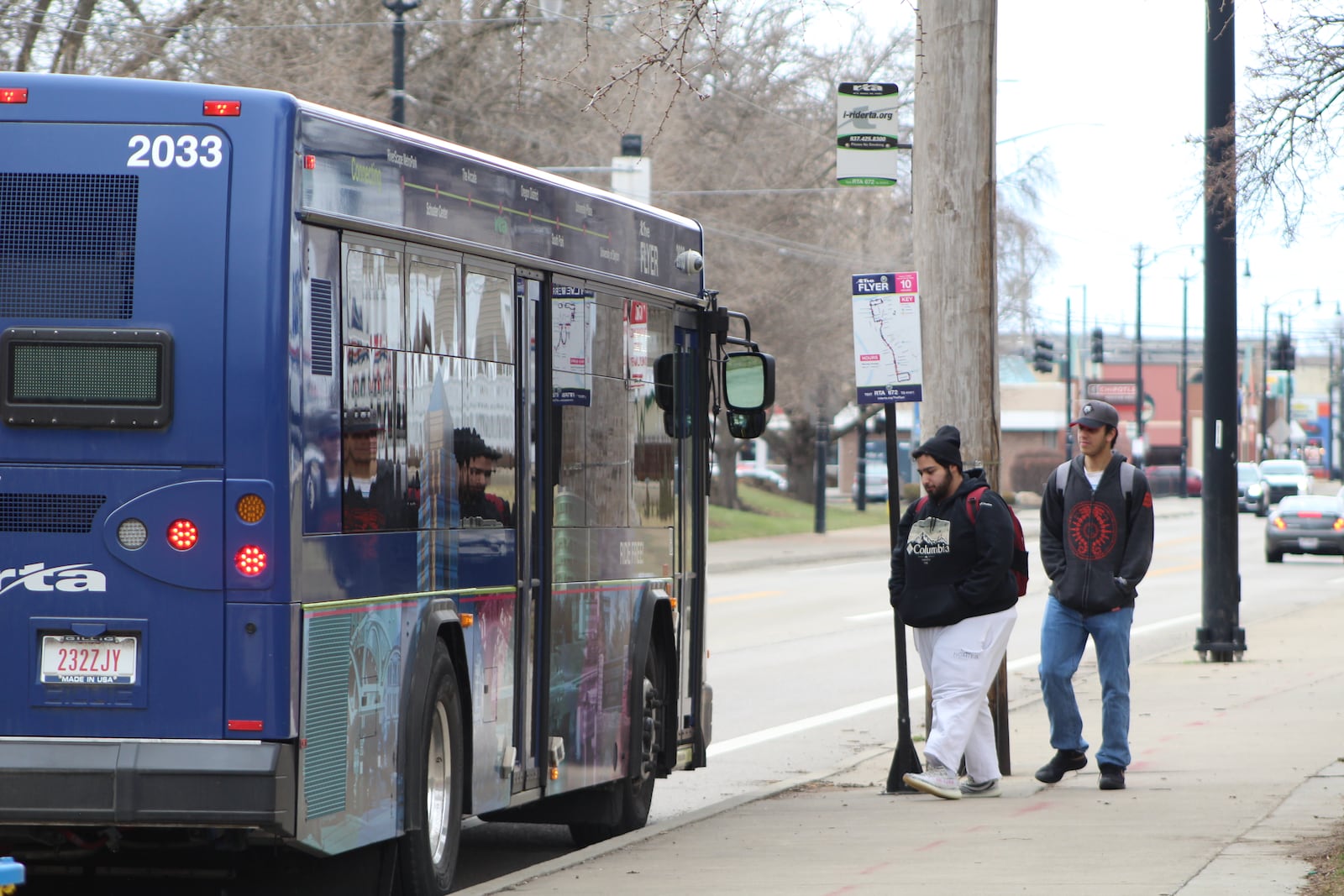 The Greater Dayton Regional Transit Authority's free Flyer bus picks up passengers on Brown Street near the University of Dayton. CORNELIUS FROLIK / STAFF