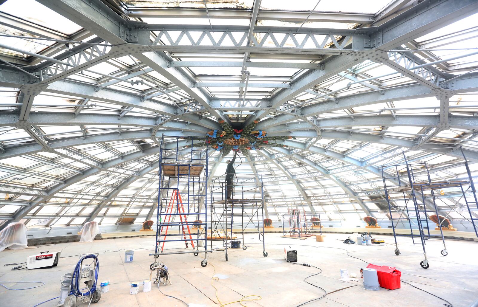 Since the Dayton Arcade opened in 1904 few people have had an up close view of the top of the dome. A temorary wood deck has been constucted for renovation. LISA POWELL / STAFF