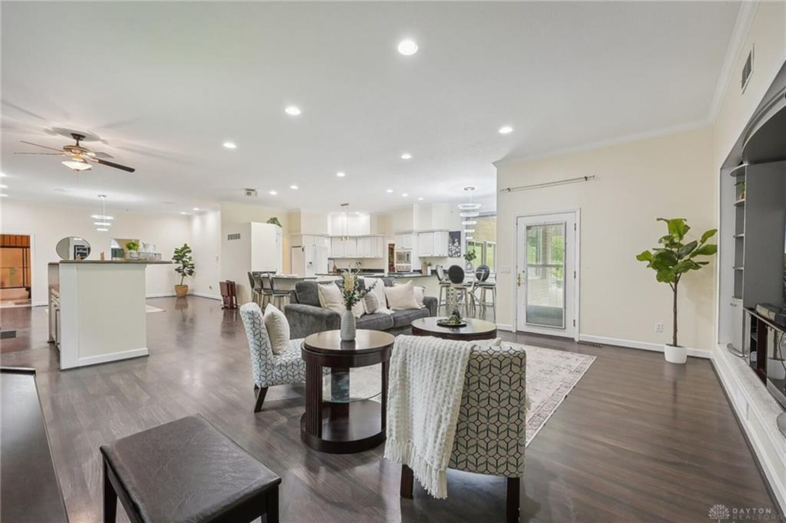 The oversized great room is open to the kitchen and breakfast area. It has a built in entertainment center and corner gas fireplace.