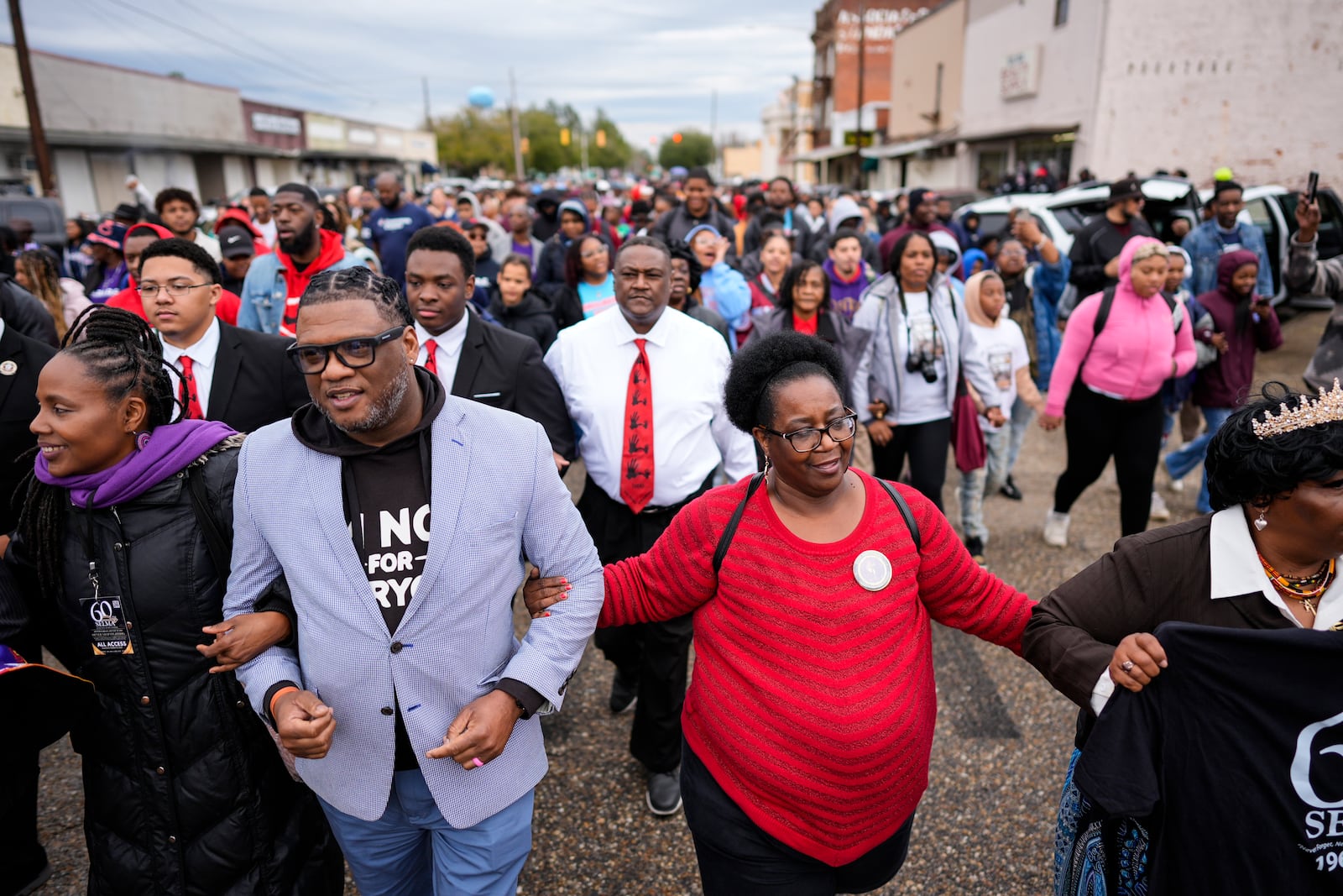 People march to the Edmund Pettus bridge during the 60th anniversary of the march to ensure that African Americans could exercise their constitutional right to vote, Sunday, March 9, 2025, in Selma, Ala. (AP Photo/Mike Stewart)