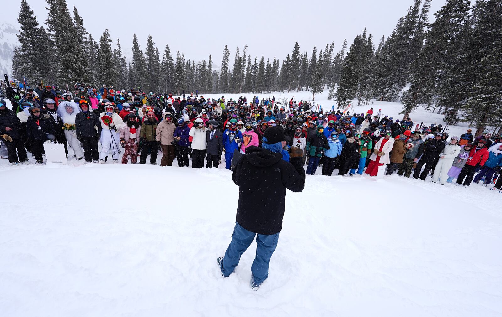 Couples gather during the 35th annual Marry Me & Ski for Free Valentine's Day mountaintop matrimony ceremony Friday, Feb. 14, 2025, at Loveland Ski Area, Colo. (AP Photo/David Zalubowski)