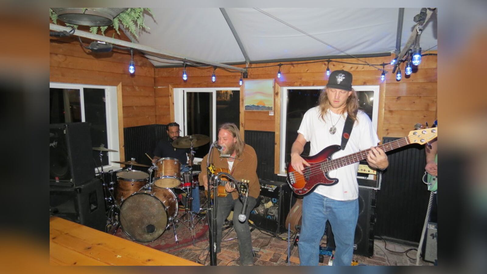 Joe Waters (sitting), who won the Telluride Blues Challenge in Colorado in September, performing with his Back Porch Band, (left to right) Saxtone Arrington, Craig Rockland and Casey Ott, performing at Trail Town Brewing in Yellow Springs.  CONTRIBUTED