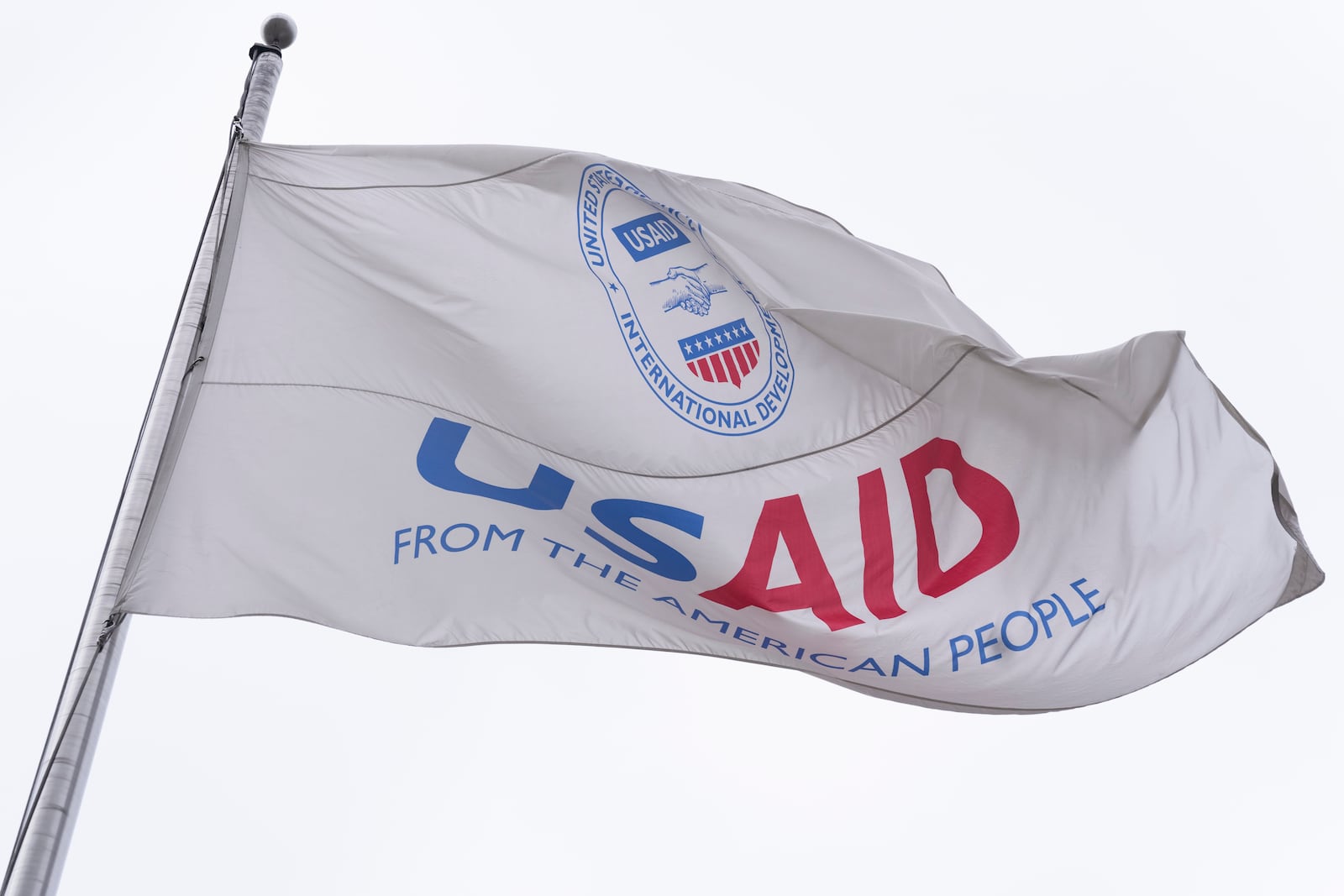 The flag of the United States Agency for International Development, or USAID, flies in front of the USAID office in Washington, Monday, Feb. 3, 2025. (AP Photo/Manuel Balce Ceneta)