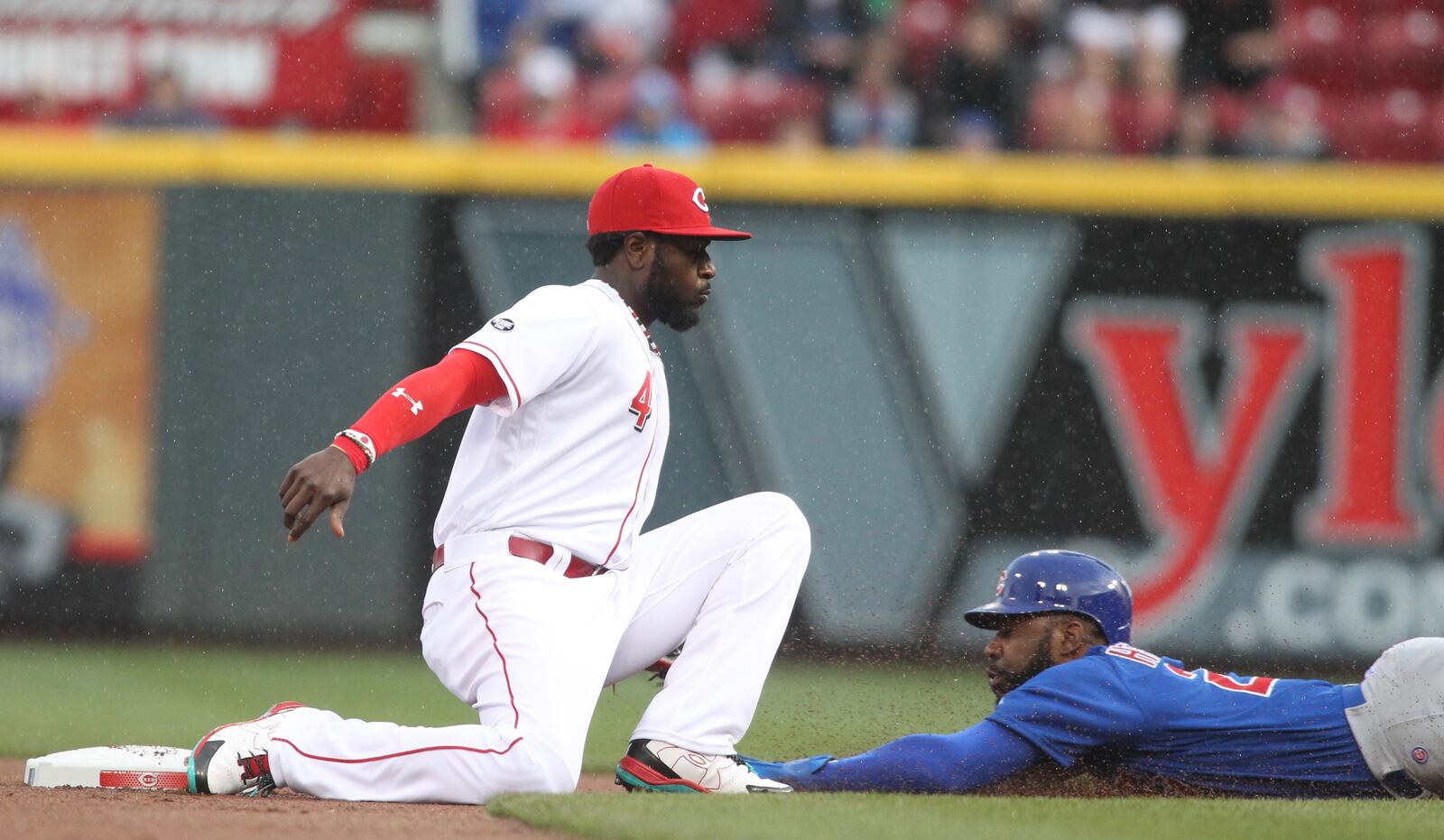 The Cubs’ Jason Heyward steals second just ahead of the tag by the Reds second baseman Brandon Phillips on Friday, April 22, 2016, at Great American Ball Park in Cincinnati. David Jablonski/Staff»