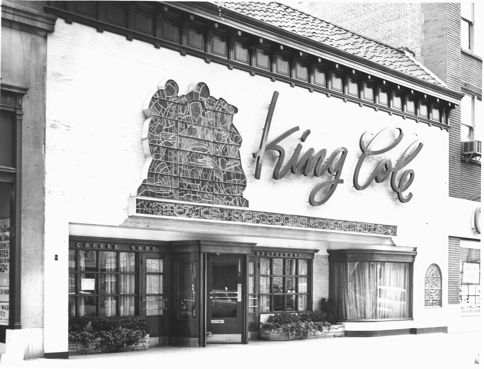 05/15/98; King Cole Restaurant, The ground-level, L-shaped restaurant wrapped around the corner and provided dining for 500 after an expansion in the early 1960s. The location was home to the restaurant until 1974, when the demolition for Courthouse Square forced a move.