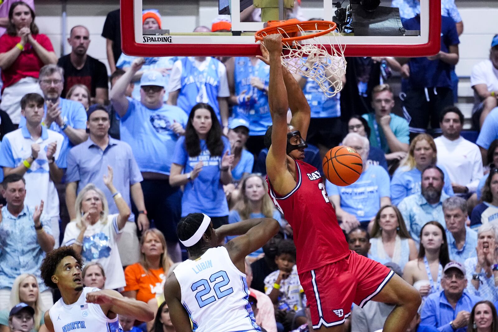 Dayton forward Zed Key dunks against North Carolina forward Ven-Allen Lubin (22) during the second half of an NCAA college basketball game at the Maui Invitational Monday, Nov. 25, 2024, in Lahaina, Hawaii. (AP Photo/Lindsey Wasson)