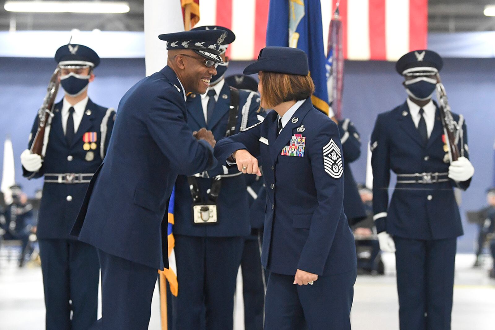 Air Force Chief of Staff Gen. Charles Q. Brown Jr. congratulates Chief Master Sgt. of the Air Force JoAnne S. Bass during the transfer of responsibility ceremony at Joint Base Andrews, Md., Aug. 14, 2020. (U.S. Air Force photo by Andy Morataya)
