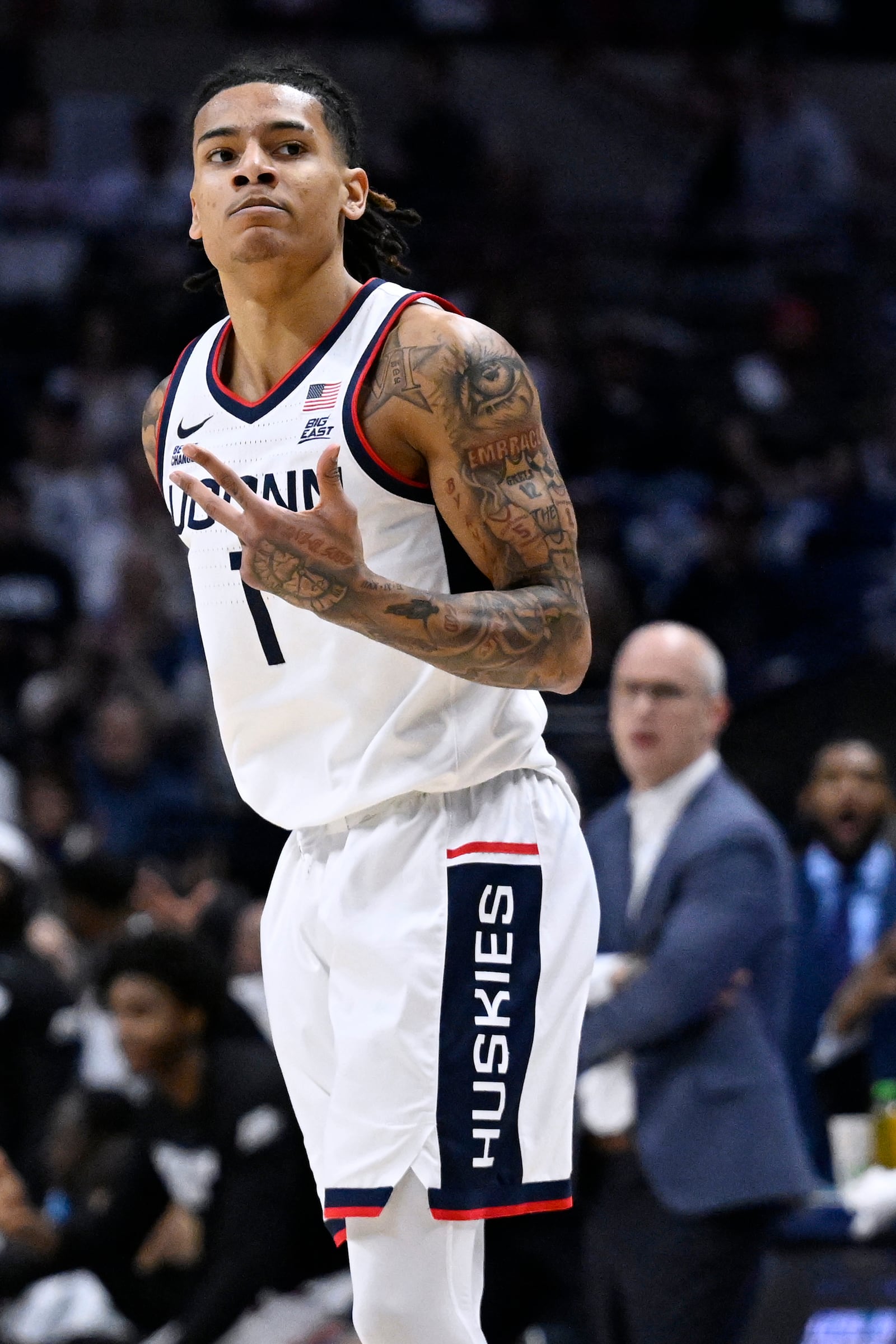 UConn guard Solo Ball (1) gestures after making a basket in the first half of an NCAA college basketball game against Creighton, Saturday, Jan. 18, 2025, in Storrs, Conn. (AP Photo/Jessica Hill)