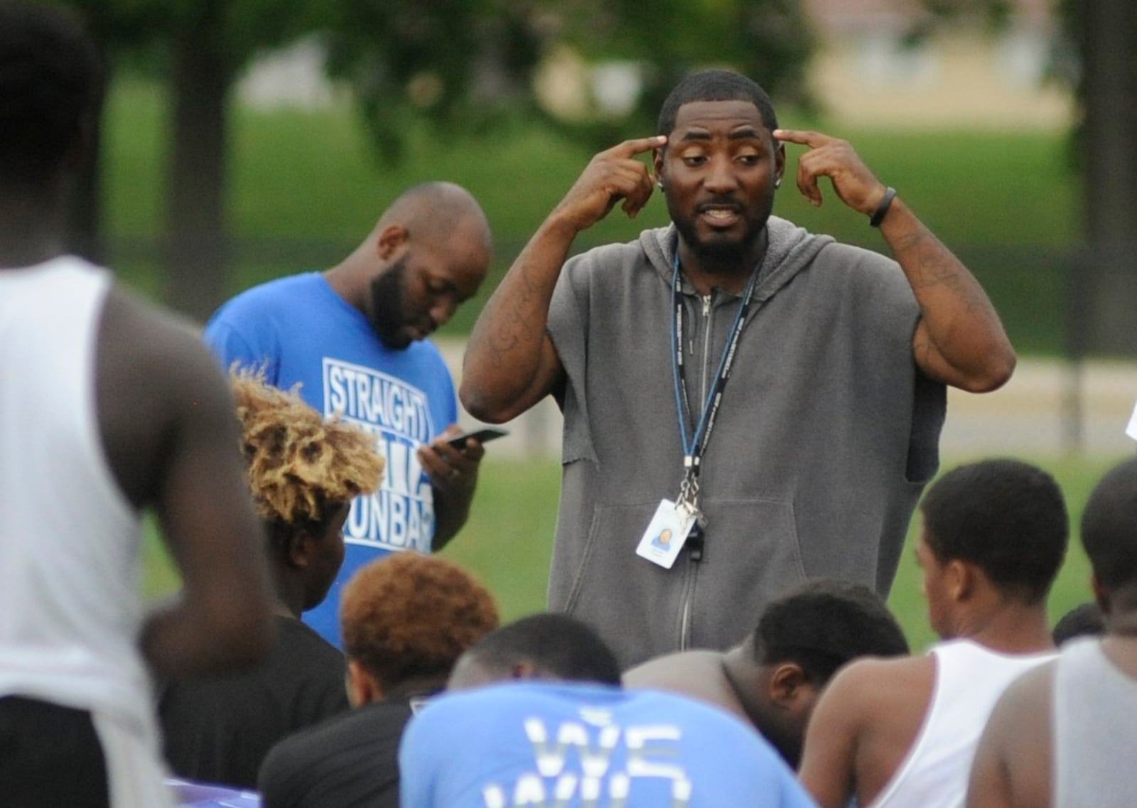 Dunbar head football coach Darran Powell addresses the Wolverines during practice in September 2016. MARC PENDLETON / STAFF