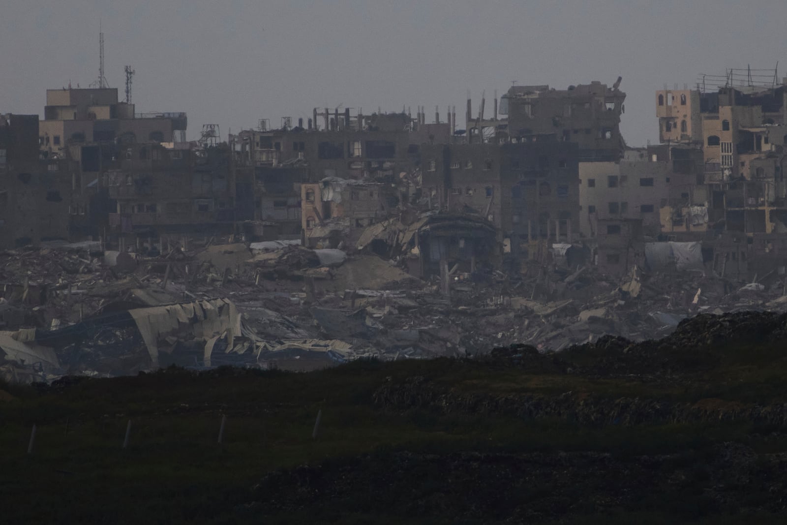 Buildings destroyed during the Israeli attack are seen in the Gaza Strip from southern Israel, Thursday, March 20, 2025. (AP Photo/Leo Correa)