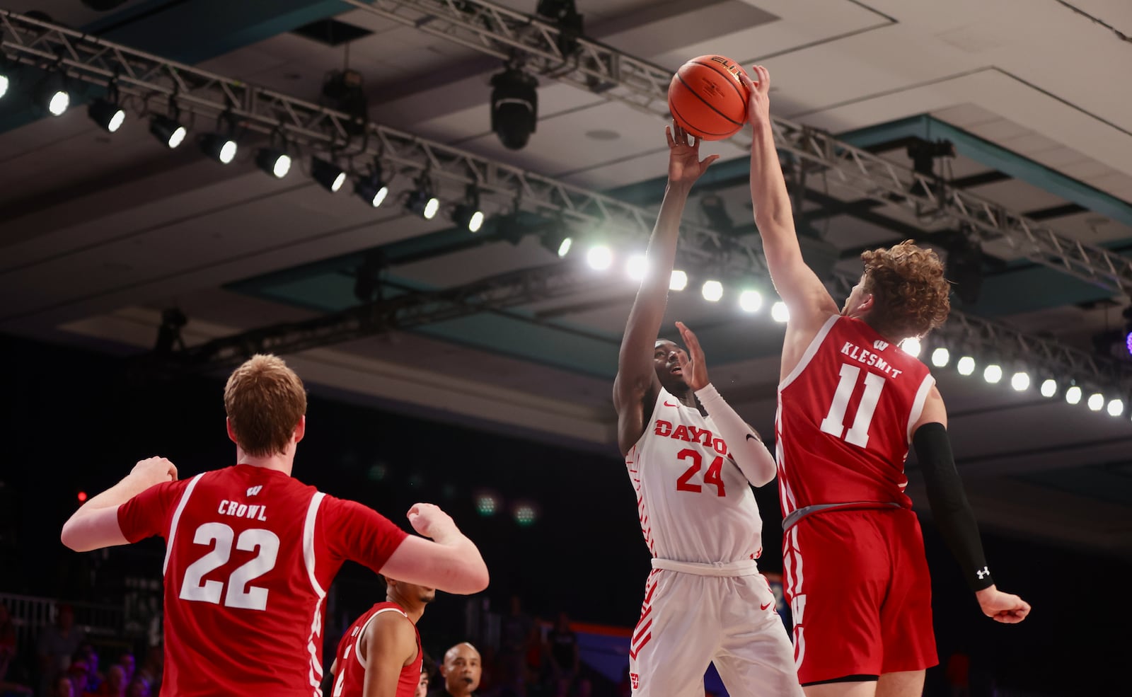 Dayton's Kobe Elvis has his shot blocked by Wisconsin's Max Klesmit in the final seconds on Wednesday, Nov. 23, 2022, in the first round of the Battle 4 Atlantis at Imperial Arena at the Paradise Island Resort in Nassau, Bahamas. David Jablonski/Staff