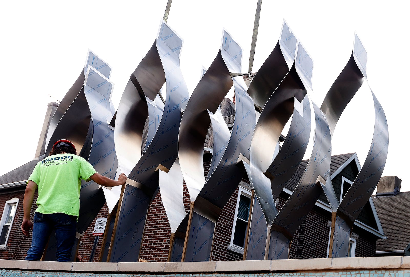 The Seed of Life sculpture for the Oregon District shooting memorial was craned in Thursday, July 25, 2024. MARSHALL GORBY\STAFF