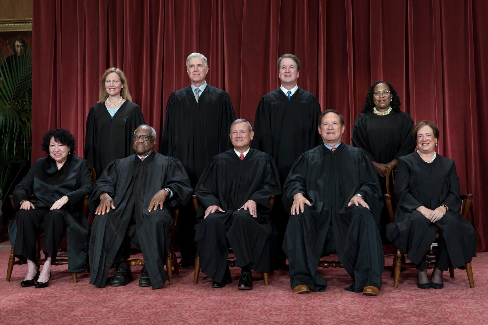 FILE - Members of the Supreme Court sit for a new group portrait following the addition of Associate Justice Ketanji Brown Jackson, at the Supreme Court building in Washington, Oct. 7, 2022. Bottom row, from left, Justice Sonia Sotomayor, Justice Clarence Thomas, Chief Justice of the United States John Roberts, Justice Samuel Alito, and Justice Elena Kagan. Top row, from left, Justice Amy Coney Barrett, Justice Neil Gorsuch, Justice Brett Kavanaugh, and Justice Ketanji Brown Jackson. (AP Photo/J. Scott Applewhite, File)