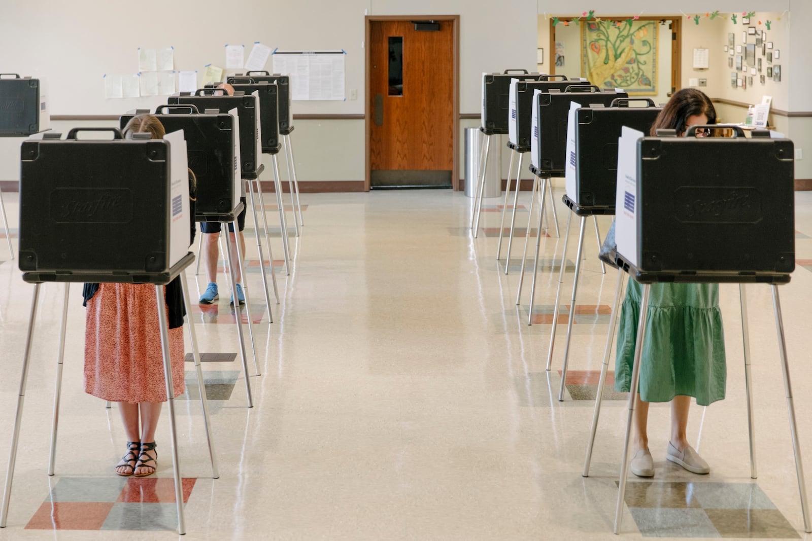 
                        Voters at the Knox Presbyterian Church in Cincinnati on Aug. 8, 2023. For months, it was clear to most Ohioans that Issue 1, advertised as a measure to safeguard the State Constitution from wealthy out-of-state interests, was primarily about blocking an abortion-rights amendment that will be on the November ballot. (Madeleine Hordinski/The New York Times)
                      