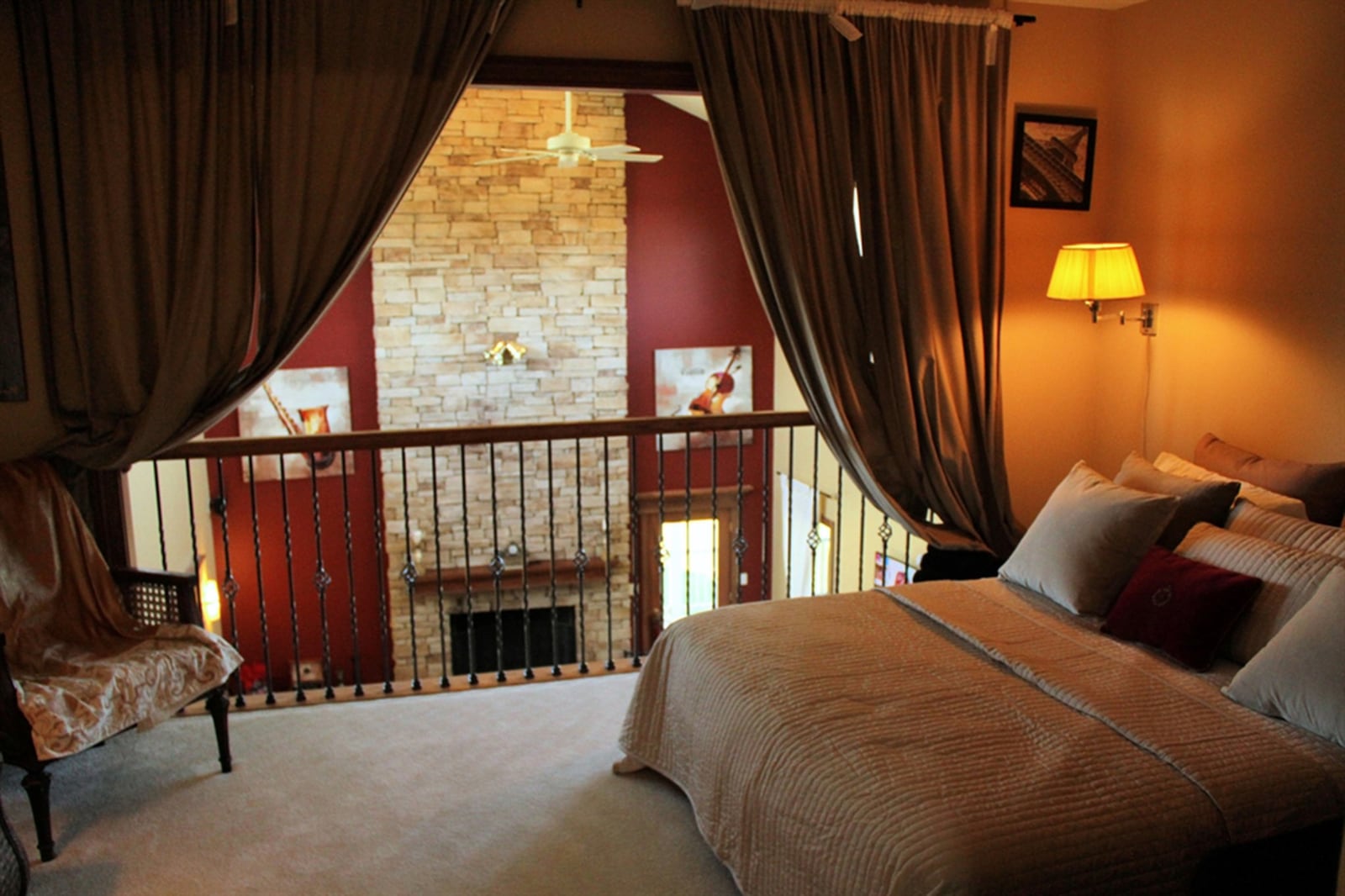 Bedroom four is a suite set in the loft area with the private bath offering a glass-enclosed shower.