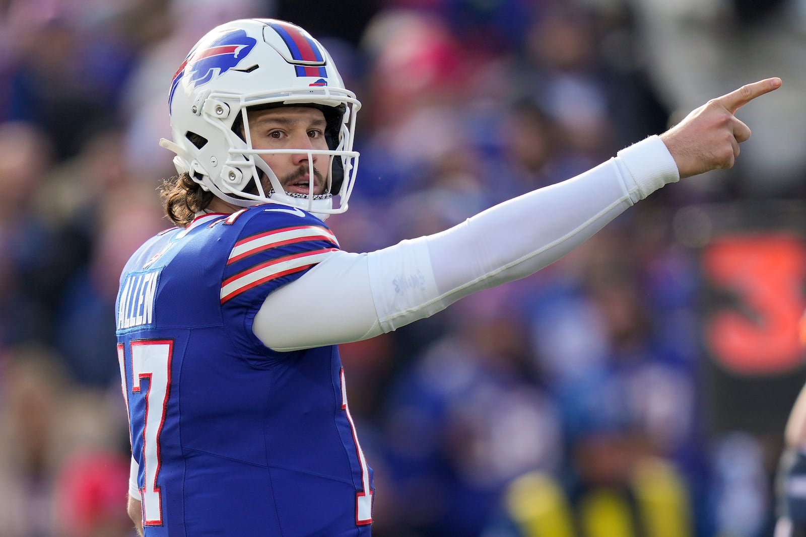 Buffalo Bills quarterback Josh Allen (17) motions for a first down during the first quarter of an NFL wild card playoff football game against the Denver Broncos, Sunday, Jan. 12, 2025, in Orchard Park, N.Y. (AP Photo/Seth Wenig)