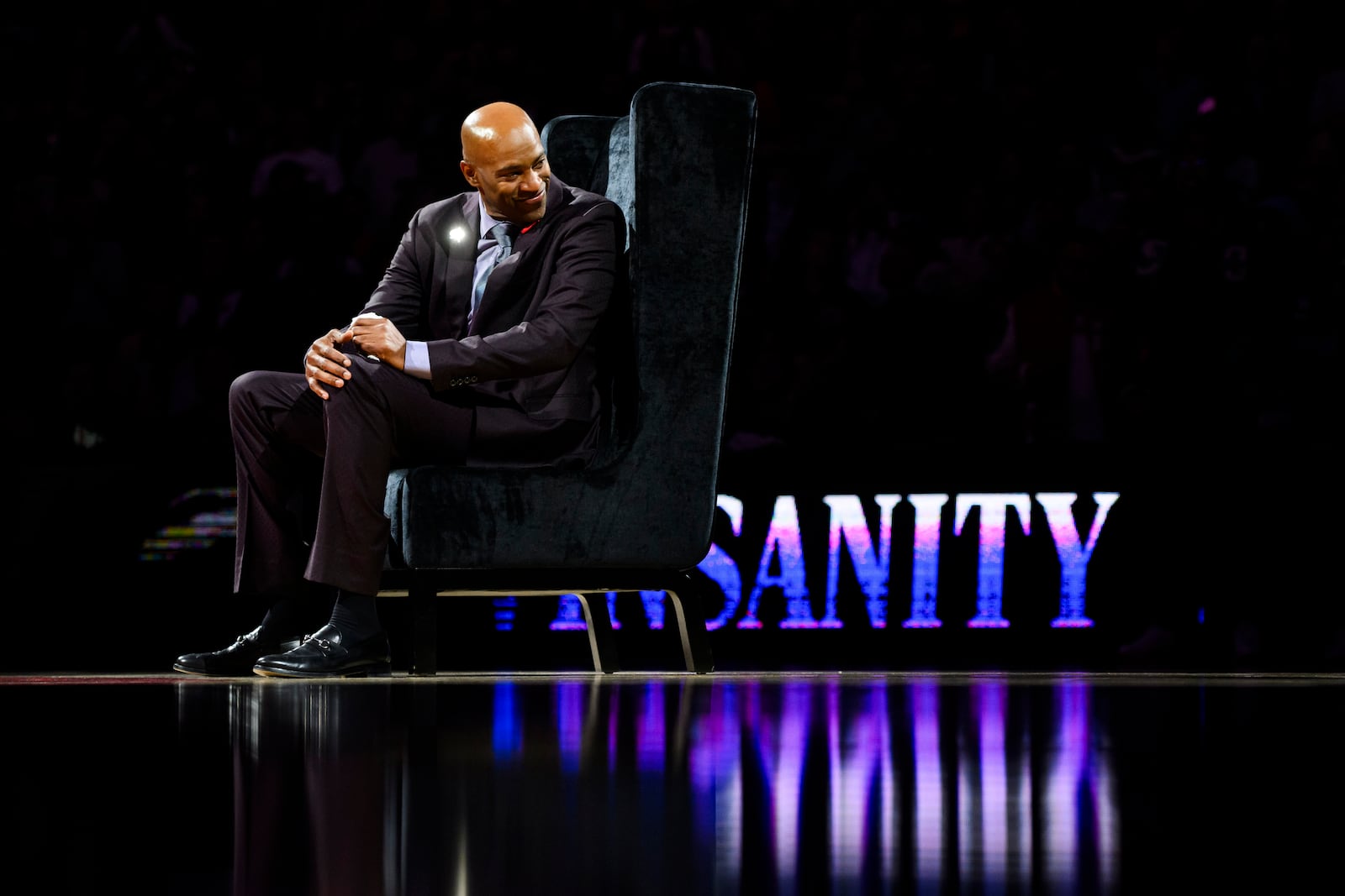 Former Toronto Raptors player Vince Carter reacts during his number retirement ceremony at halftime of an NBA basketball game between the Toronto Raptors and the Sacramento Kings in Toronto on Saturday, Nov. 2, 2024. (Christopher Katsarov/The Canadian Press via AP)