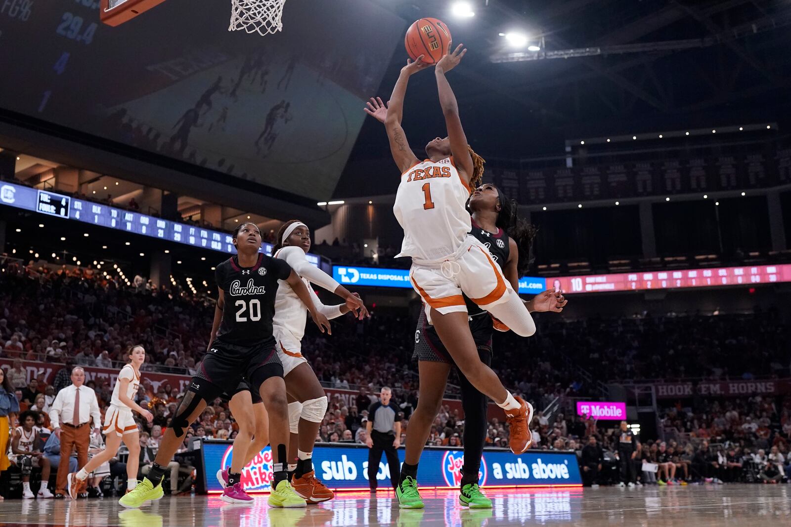 Texas guard Bryanna Preston (1) drives to the basket against South Carolina during the second half of an NCAA college basketball game in Austin, Texas, Sunday, Feb. 9, 2025. (AP Photo/Eric Gay)