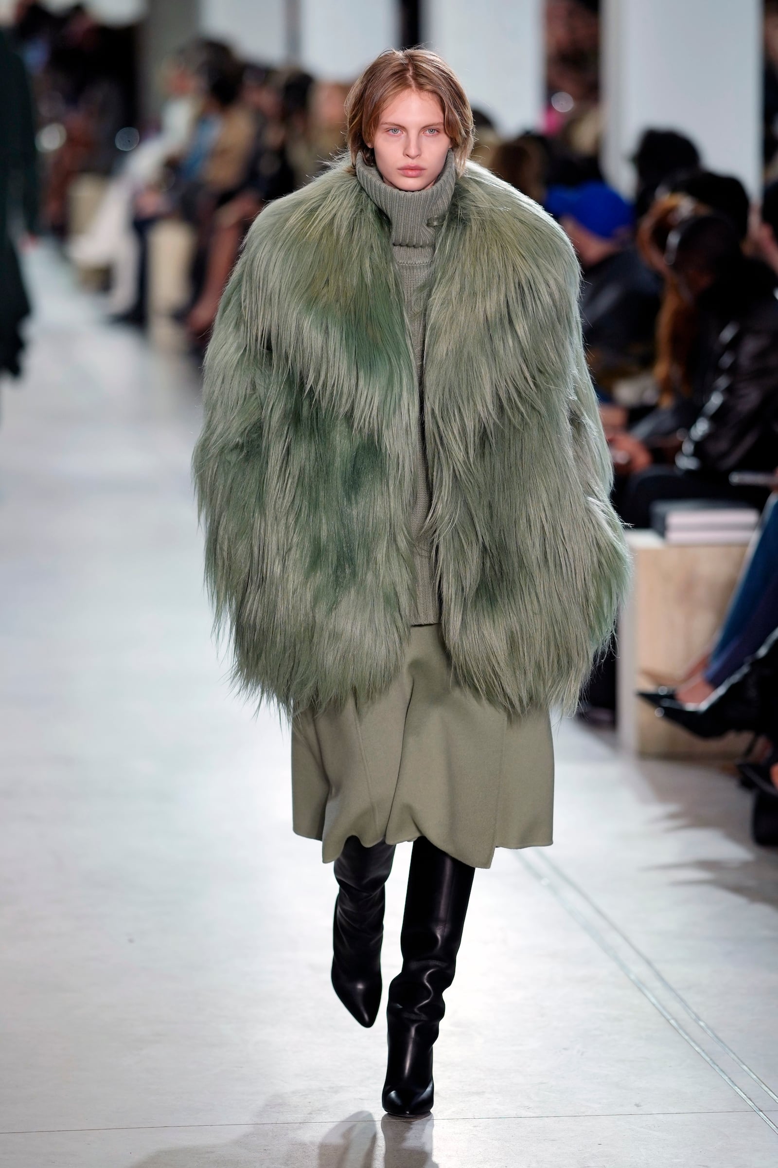 A model walks the runway during the Michael Kors Fall/Winter 2025 fashion show as part of New York Fashion Week on Tuesday, Feb. 11, 2025, at Terminal Warehouse in New York. (Photo by Charles Sykes/Invision/AP)