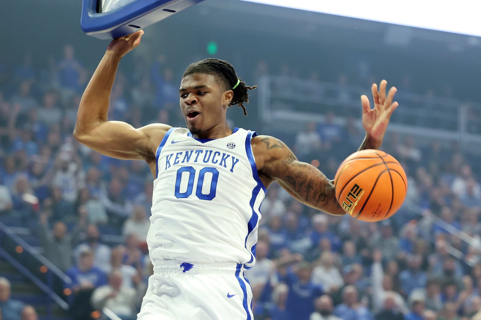 Kentucky's Otega Oweh reacts after dunking during the first half of an NCAA college basketball game against Wright State in Lexington, Ky., Monday, Nov. 4, 2024. (AP Photo/James Crisp)