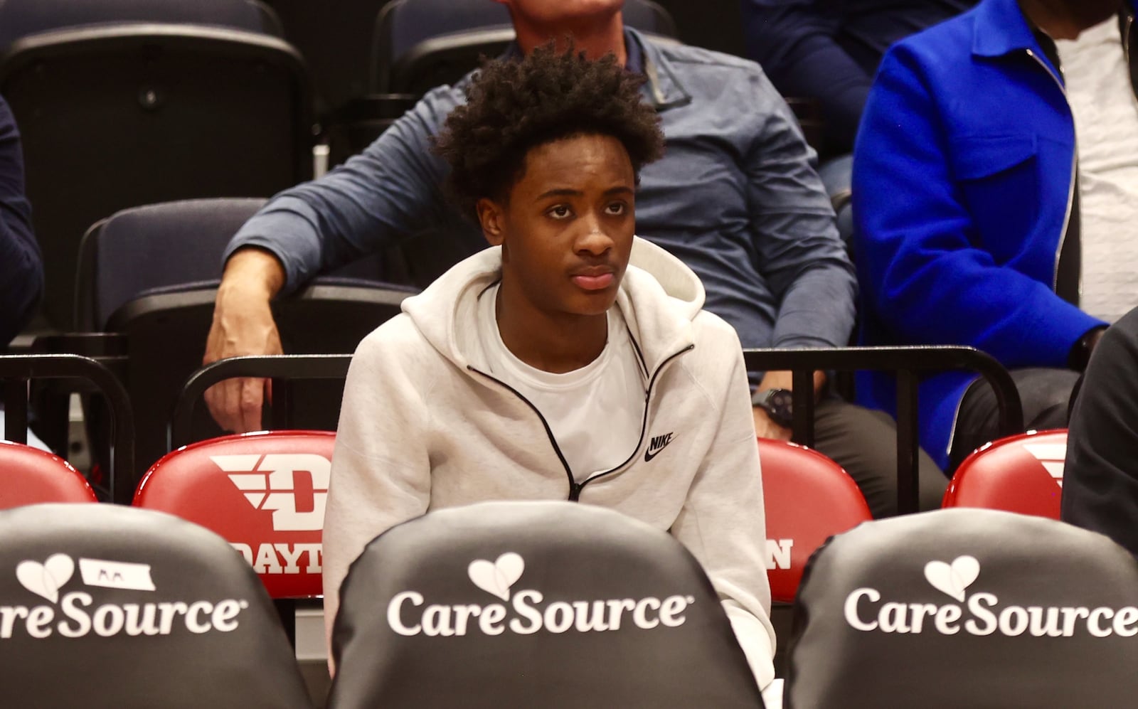 Dazon Reid, a class of 2027 recruit from Huntington Prep, watches from behind the bench as Dayton plays New Mexico State on Wednesday, Nov. 20, 2024, at UD Arena. David Jablonski/Staff