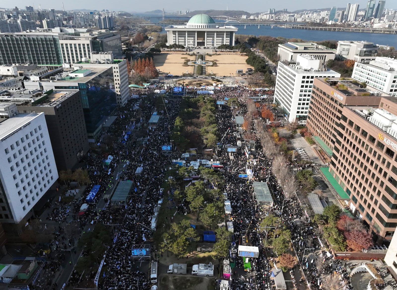 Participants gather during a rally to demand South Korean President Yoon Suk Yeol's impeachment outside the National Assembly in Seoul, South Korea, Saturday, Dec. 14, 2024. (Kim Do-hoon/Yonhap via AP)