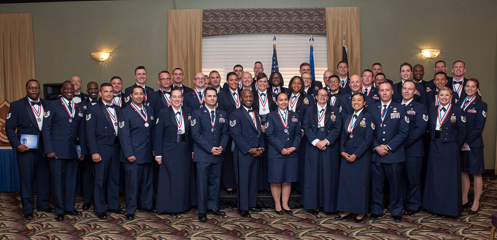 Airmen promoted to master sergeant pose for a group photo July 23 during the Senior Noncommissioned Officer Induction Ceremony at Wright-Patterson Air Force Base. U.S. AIR FORCE PHOTO/WESLEY FARNSWORTH